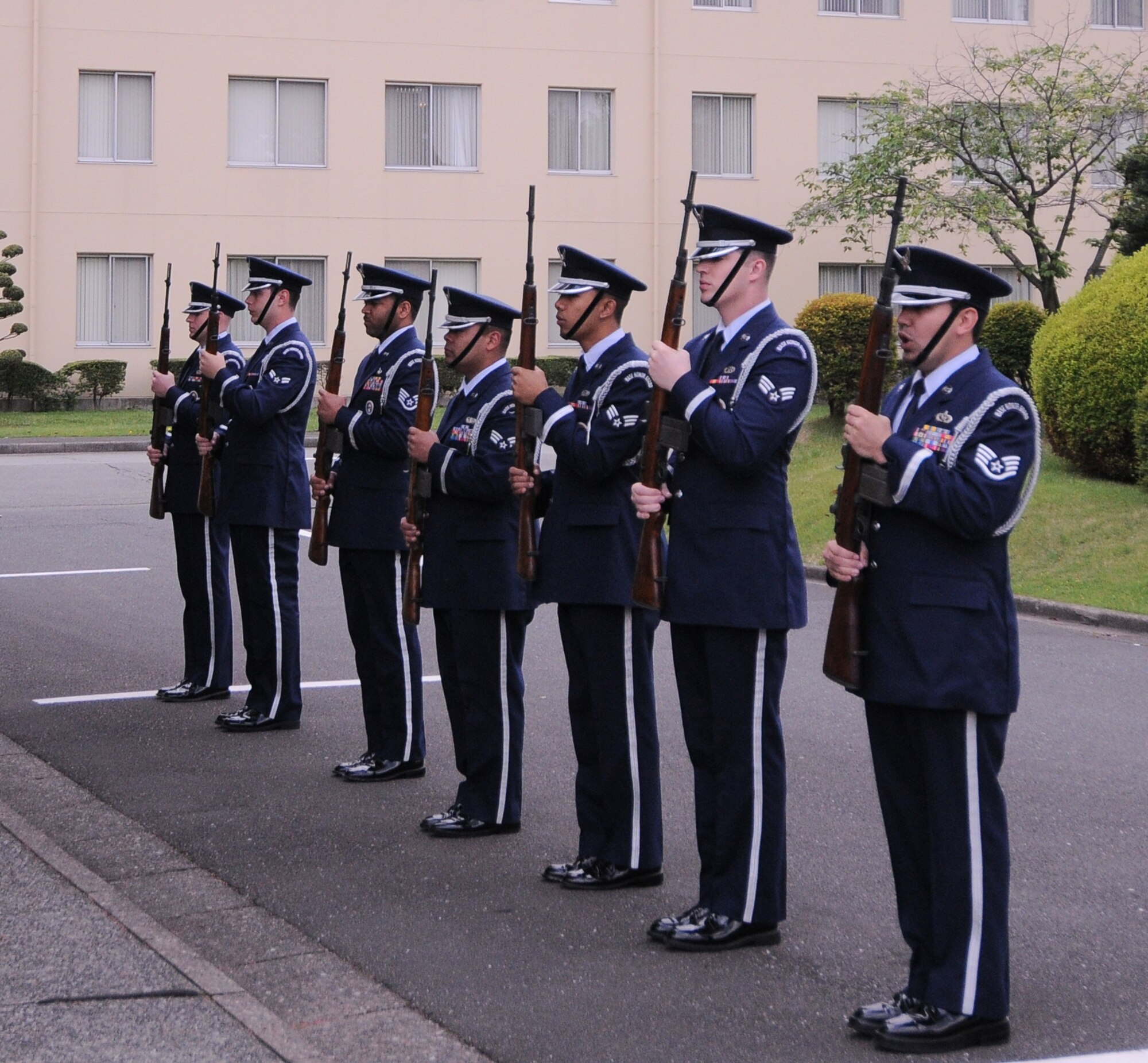 YOKOTA AIR BASE, Japan -- Members of Yokota's Honor Guard prepare for the 21-gun salute during the Memorial Day ceremony at the Officer's Club here May 31. Memorial Day is observed on the last Monday of May and was designated to pay tribute to U.S. men and women who died while serving their country. Yokota's American Legion post 2222 holds the ceremony every year to carry on the tradition which first took place at Arlington National Cemetery in 1868. (U.S. Air Force photo/Airman 1st Class Lynsie Lorenz)