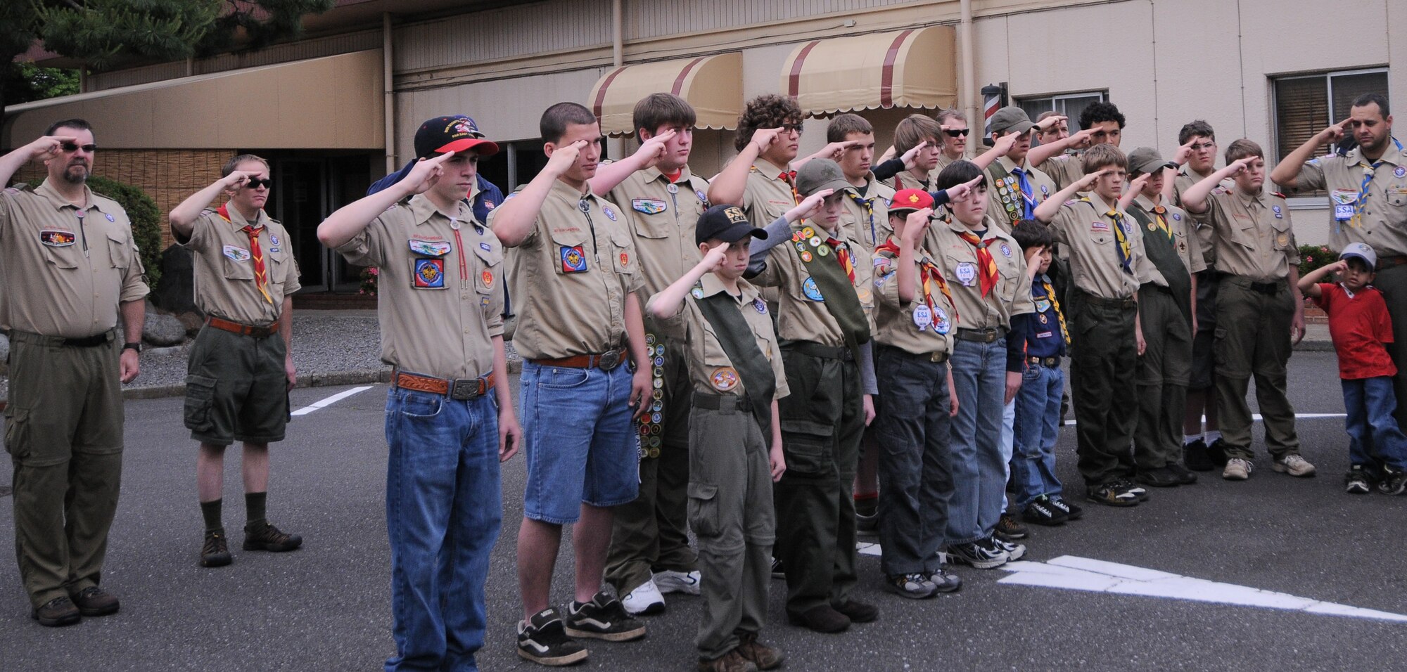 YOKOTA AIR BASE, Japan -- Boy Scout Troops 17, 45 and 49 salute during the Memorial Day ceremony at the Officer's Club here May 31. Memorial Day is observed on the last Monday of May and was designated to pay tribute to U.S. men and women who died while serving their country. Yokota's American Legion post 2222 holds the ceremony every year to carry on the tradition which first took place at Arlington National Cemetery in 1868. (U.S. Air Force photo/Airman 1st Class Lynsie Lorenz)