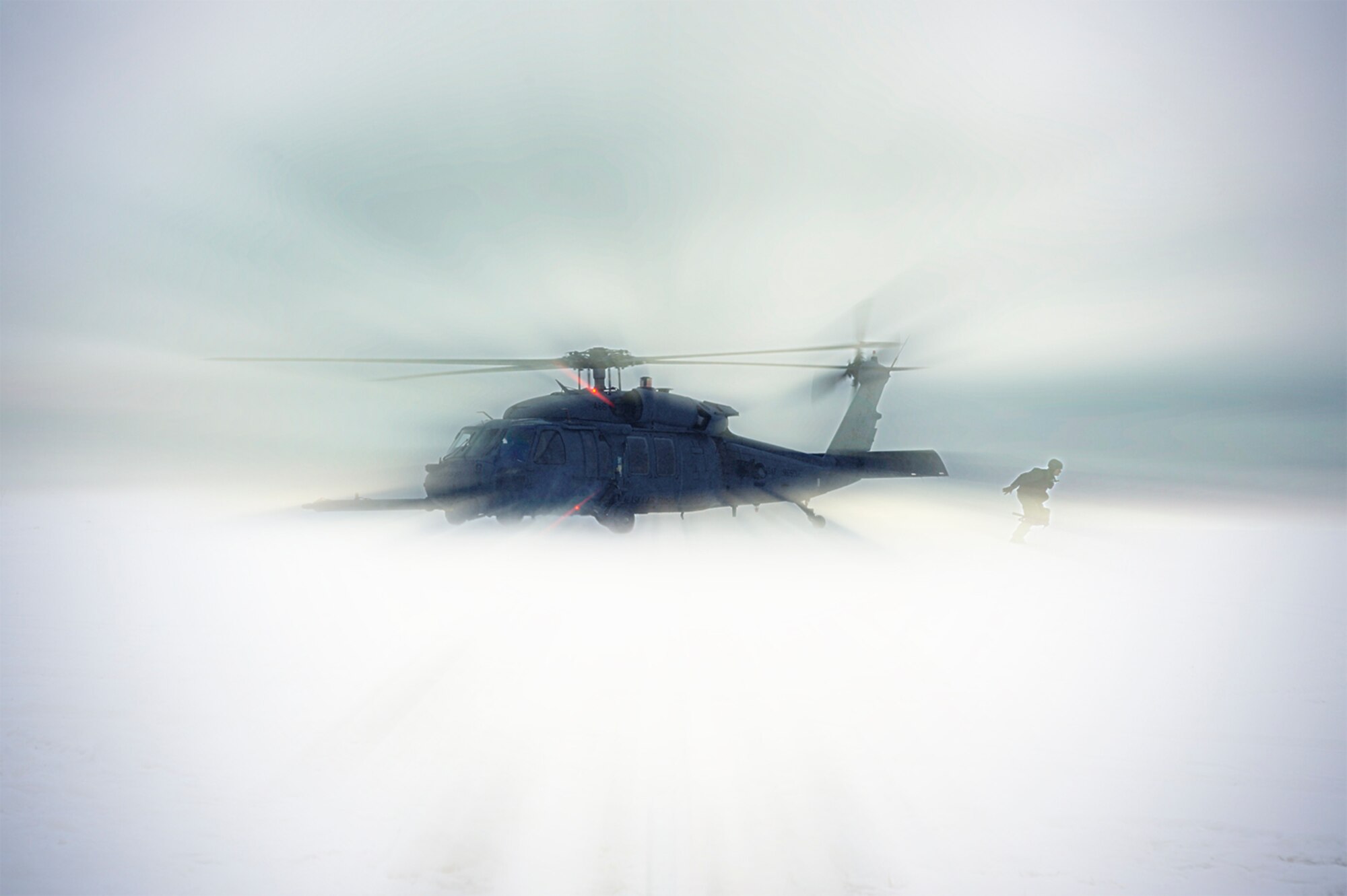 1st Lt. Matthew Feeman, 80th Fighter Squadron, Kunsan Air Base, Korea exits from a HH-60 Pave Hawk out onto the Pacific Alaskan Range Complex during RED FLAG-Alaska 09-1 Oct. 14, 2008, at Eielson Air Force Base, Alaska. RF-A is a Pacific Air Forces-directed field training exercise for U.S. and coalition forces flown under simulated air-combat conditions. It is conducted on the PARC with air operations flown out of Eielson and Elmendorf Air Force Bases. The aircraft is assigned to Detachment 1, 210th Rescue Squadron.  (U.S. Air Force photo/Senior Airman Jonathan Snyder) (Released)