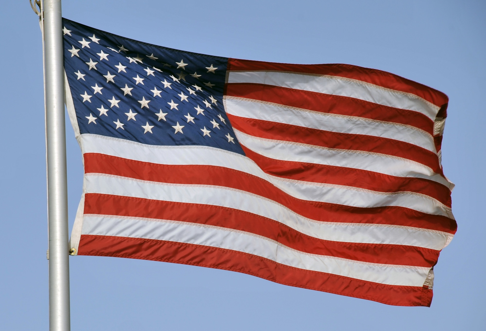 The American flag flies on the flagpole for the 380th Air Expeditionary Wing at a non-disclosed base in Southwest Asia on May 29, 2010. (U.S. Air Force Photo/Master Sgt. Scott T. Sturkol/Released)