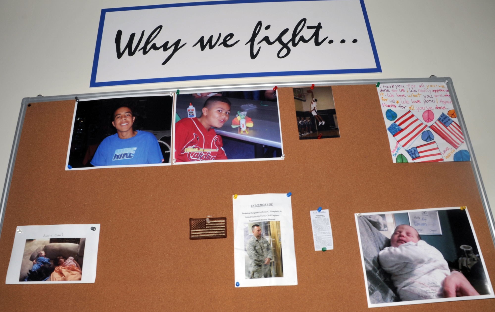 This is a bulletin board stating the words, "Why we fight," is in a building for the 380th Air Expeditionary Wing at a non-disclosed base in Southwest Asia as shown on May 30, 2010.  (U.S. Air Force Photo/Master Sgt. Scott T. Sturkol/Released)  