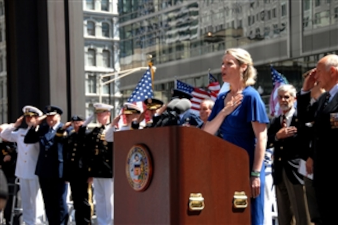 Alison Ruble with the USO of Illinois sIngs the National Anthem at the 2010 Chicago Memorial Day Commemoration and Wreath Laying Ceremony held at Daley Plaza, Chicago, May 29, 2010. The theme of the 2010 Chicago Memorial Day Parade, one of the largest parades in the nation, was “Honoring Our Military Families.” 