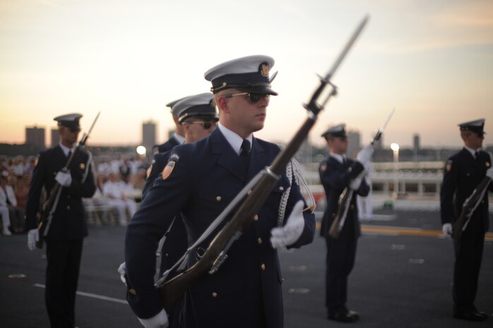 NEW YORK -- Members of the U.S. Coast Guard Silent Drill Team perform during the Sunset Parade on USS Iwo Jima, May 30, 2010, here. More than 3,000 Marines, Sailors and Coast Guardsmen are in the area participating in community outreach events and equipment demonstrations. This is the 26th year New York City has hosted the sea services for Fleet Week. (Official Marine Corps photo by Sgt. Randall A. Clinton / RELEASED)