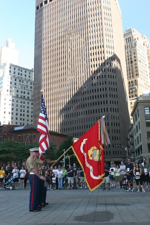 The color guard for 8th Marine Regiment, 2nd Marine Division, presents the national colors during the singing of the National Anthem before the 2010 Big Apple Run for the Warrior race.  More than 130 participants raced along the southern tip of Manhattan in support of wounded warriors.