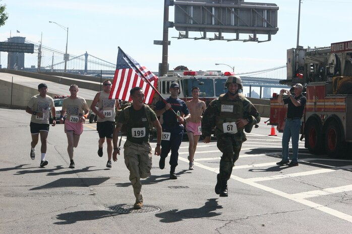 Evan Van Nostrand and Christopher Delaney run ahead of wounded service members during the 2010 Big Apple Run for the Warrior, May 30, in Manhattan N.Y.  Delaney and Van Nostrand ran in memory of two service members recently killed in the line of duty.