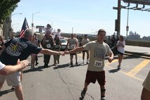 Sean Debevoise was the last to cross the finish line during the 2010 Big Apple Run for the Warrior, May 30, here.  More than 130 runners from across Manhattan showed up to participate and show their support for the Wounded Warrior Foundation.