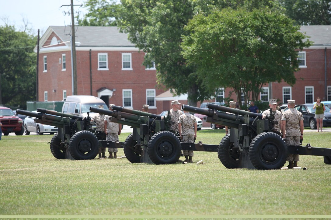 Three howitzers from 5th Battalion, 10th Marine Regiment, 2nd Marine Division, stand ready to fire a 21-gun salute during a Memorial Day ceremony in front of Building 1 aboard Marine Corps Base Camp Lejeune, May 31. In respects of Memorial Day the base took a moment to recognize the men and women who have paid the ultimate sacrifice in defense of America.