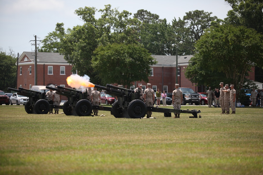 Three howitzers from 5th Battalion, 10th Marine Regiment, 2nd Marine Division, fired a 21-gun salute in honor of Memorial Day in front of Building 1 aboard Marine Corps Base Camp Lejeune, May 31. The guns fired at noon in recognition of all the men and women who died in the pursuit and defense of freedom.