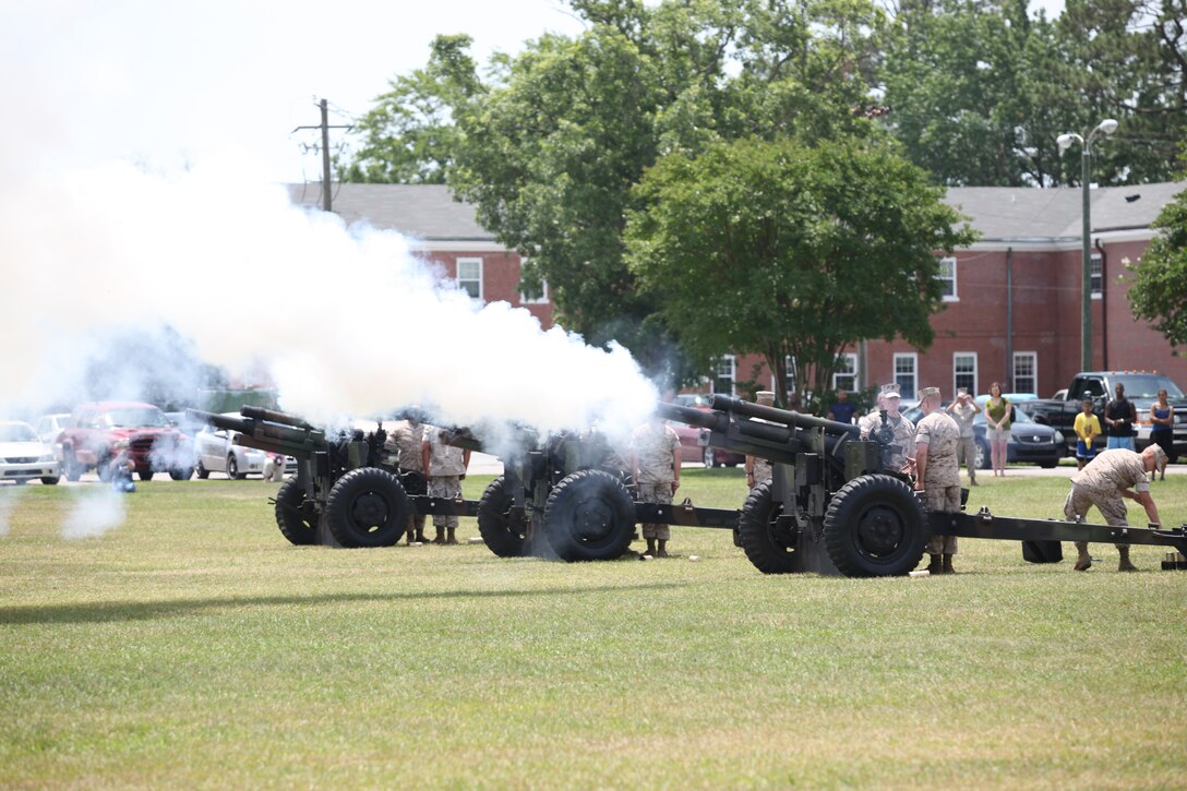 Three howitzers from 5th Battalion, 10th Marine Regiment, 2nd Marine Division, fired a 21-gun salute in honor of Memorial Day in front of Building 1 aboard Marine Corps Base Camp Lejeune, May 31. The guns fired at noon in recognition of all the men and women who died in the pursuit and defense of freedom.