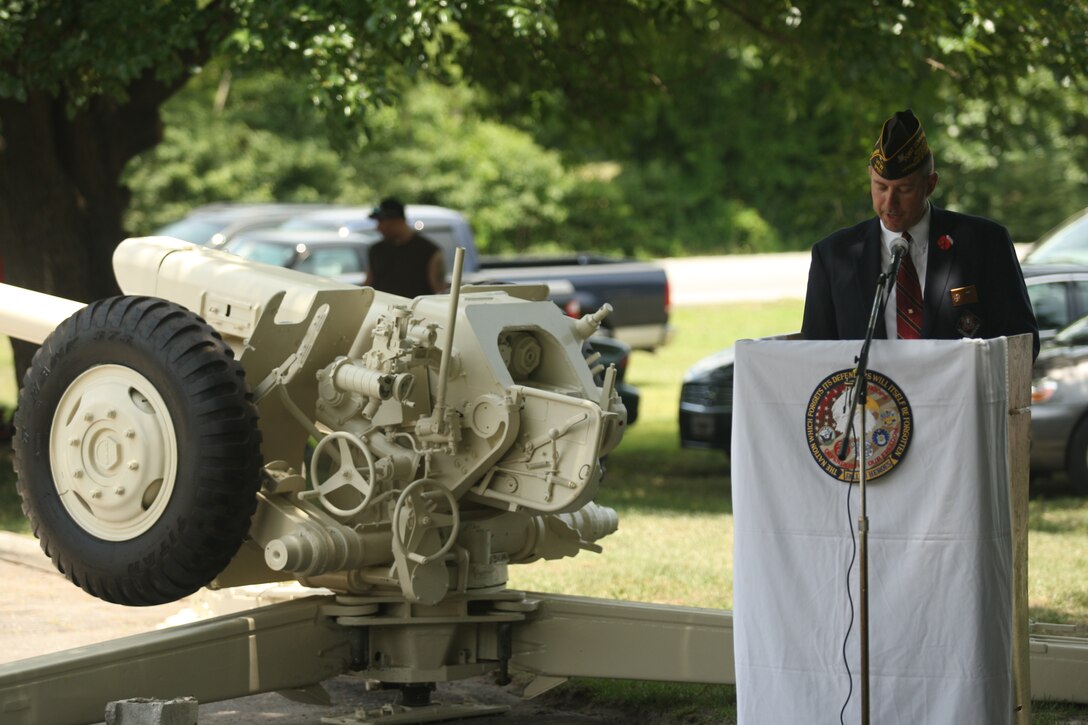 Timothy Stone, commander of Veterans of Foreign Wars Post 9133, Jacksonville, N.C., speaks during the Memorial Day ceremony where a refurbished Soviet 122mm howitzer D-30 was dedicated to veterans of Operation Iraqi Freedom/Operation Enduring Freedom/Global War on Terror, May 31. After more than two months of rebuilding, the howitzer went from a rusty relic lost in the woods to a war antique to be maintained and kept in the remembrance of those who have given their lives in the Middle East.