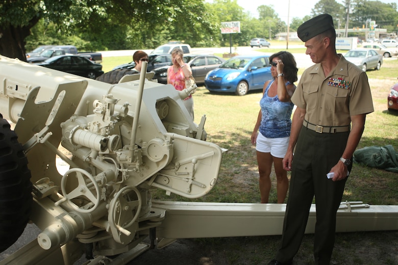 Col. Richard P. Flatau Jr., commanding officer of Marine Corps Base Camp Lejeune, admires the newly-dedicated Iraqi War memorial, a refurbished Soviet 122mm howitzer D-30, after the dedication ceremony at the Veterans of Foreign Wars Post 9133, May 31. Dedicated to veterans of Operation Iraqi Freedom/Operation Enduring Freedom/Global War on Terror, the howitzer now sits in the VFW parking lot, a war relic taken in combat, dedicated to this generations’ war fighters.