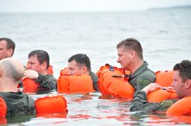 934th Airlift Wing members wait to be "rescued" during water survival training in Key West, Fla. (Air Force Photo/Senior Airman Noah Johnson)
