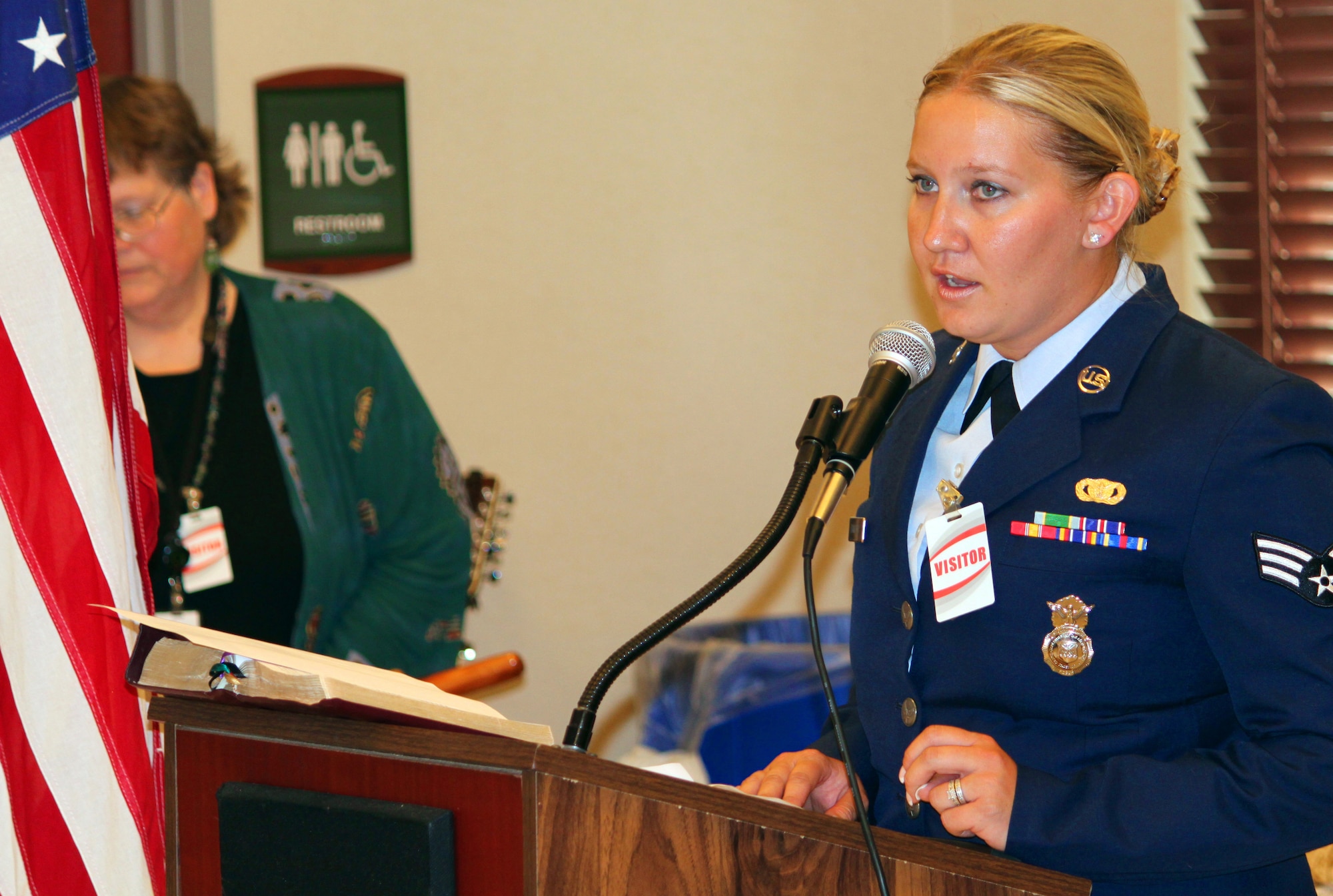 Senior Airman Lyndee Banister reads the poem, In Flanders Field, at a Memorial Day Observance at the VA Nursing Home at Fitzsimons in Aurora, Colo. on May 27.  (U.S. Air Force photo by Tech. Sgt. Scott P. Farley)