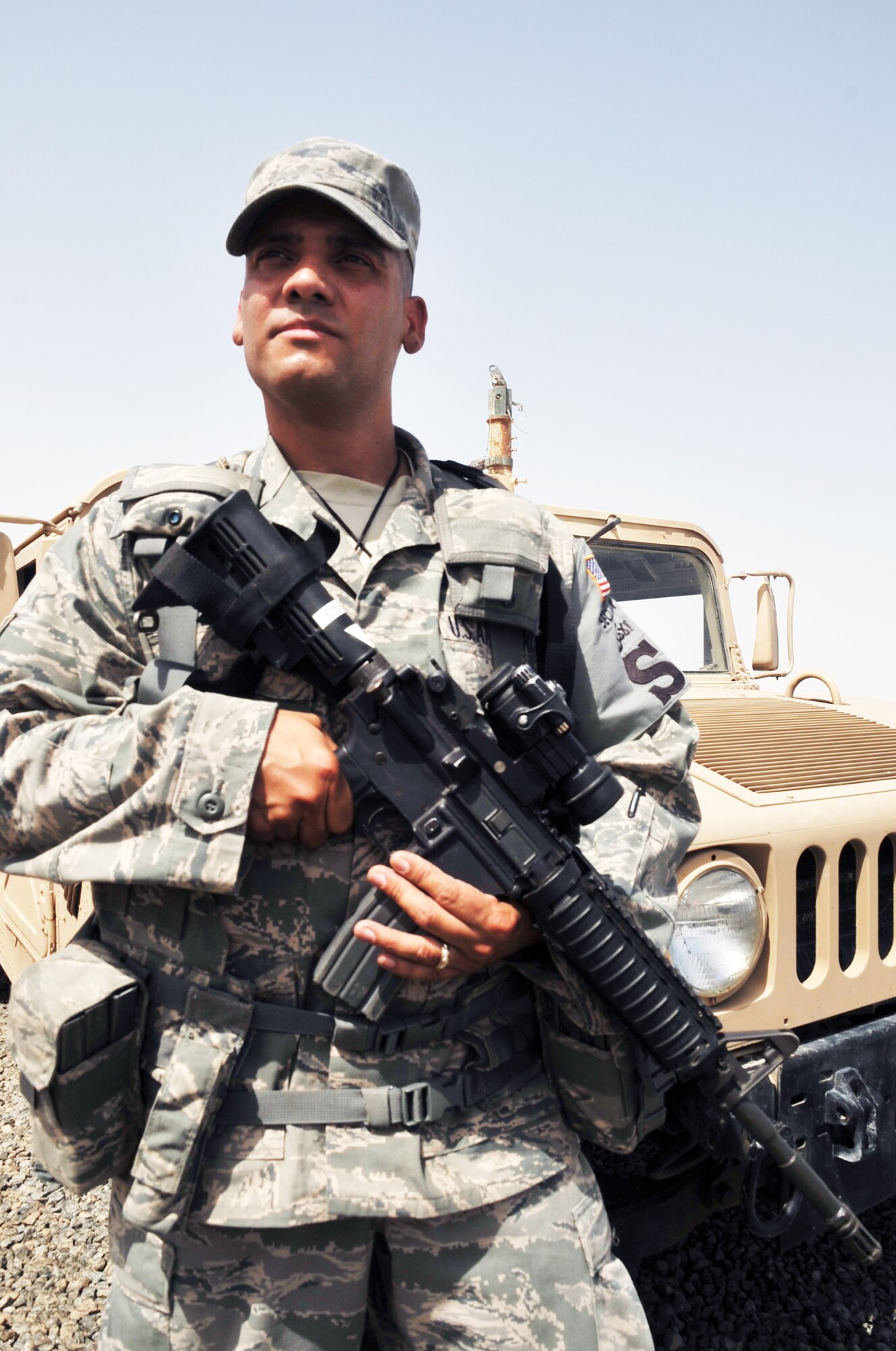 Tech. Sgt. Julio Cedeno, security forces craftsman with the 380th Expeditionary Security Forces Squadron, works in security forces operations area at a non-disclosed base in Southwest Asia on May 29, 2010. Sergeant Cendeno is deployed from the 27th Security Forces Squadron at Cannon Air Force Base, Ariz., and his hometown is Jersey City, N.J. (U.S. Air Force Photo/Master Sgt. Scott T. Sturkol)