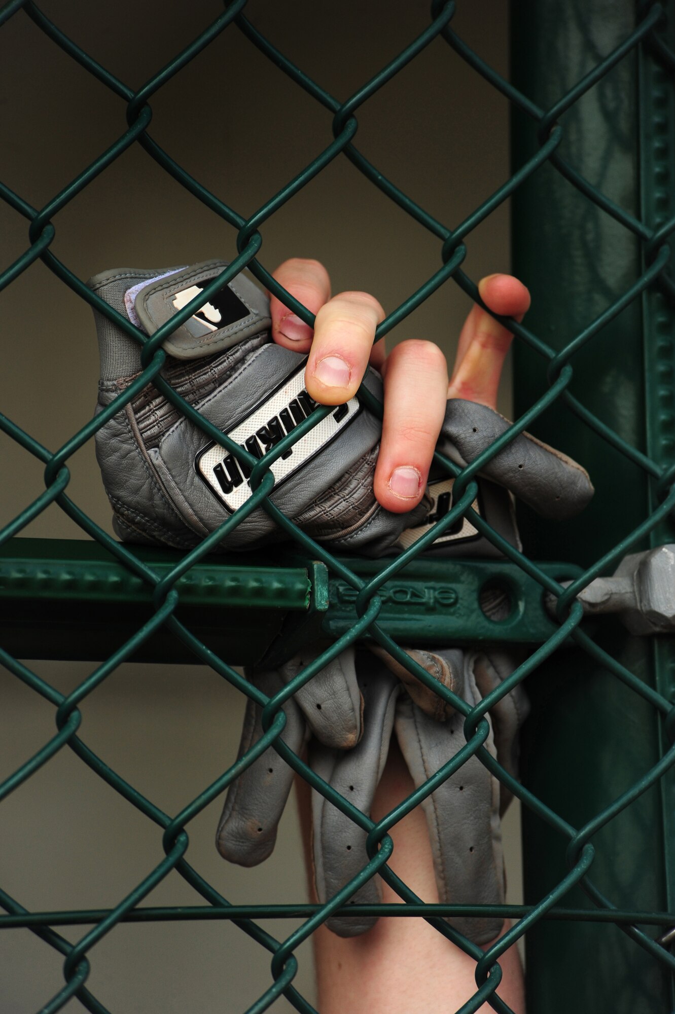 A member of the Ramstein Royals High School baseball team waits his turn at bat during a play-off game of the Department of Defense Dependent Schools Europe Baseball European Championships, Ramstein Air Base, Germany, May 29, 2010. The three-day championships consisted of high school teams from all over the European theater in Divisions I, II and III. (U.S. Air Force photo by Staff Sgt. Jocelyn Rich)