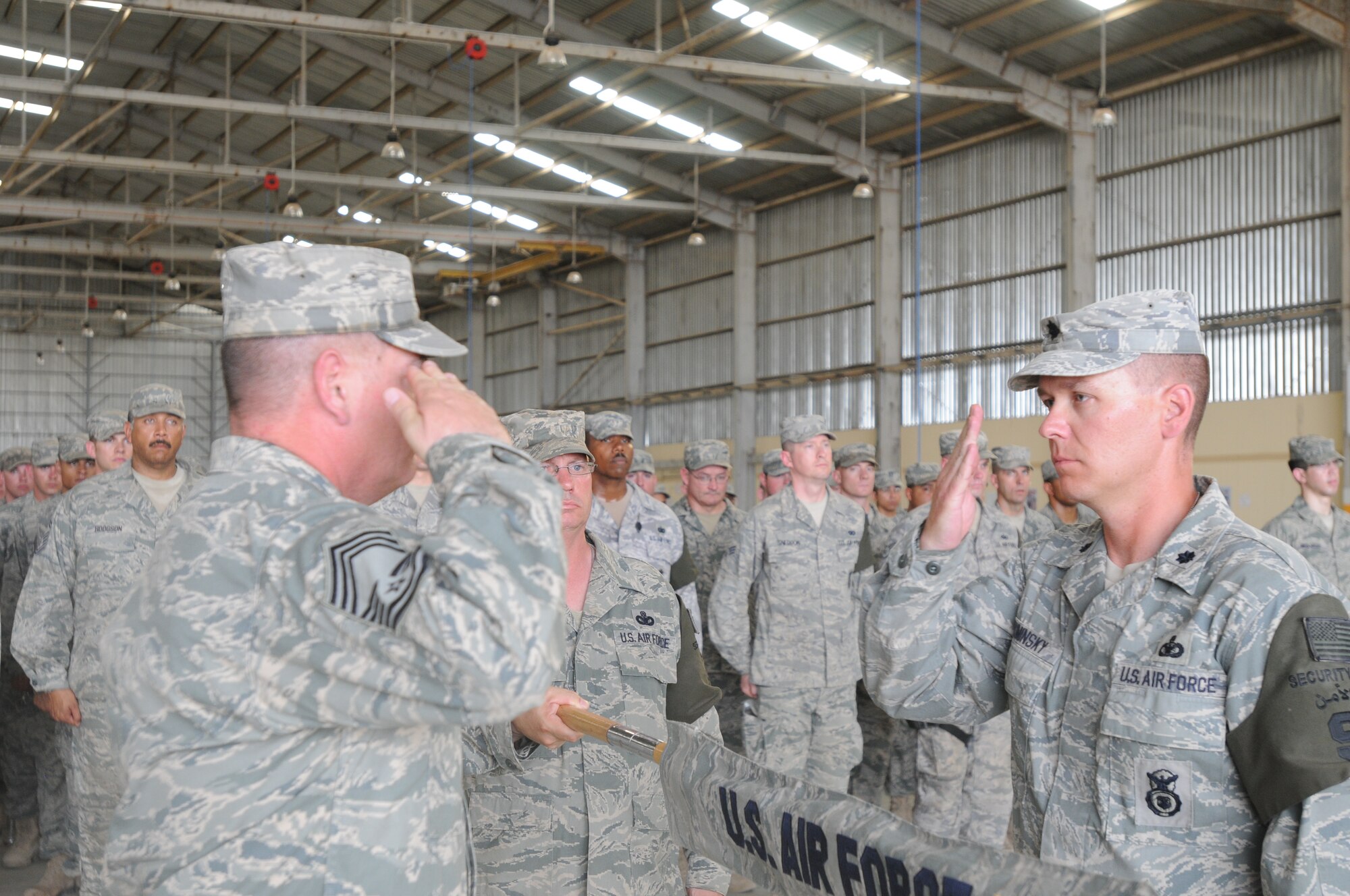 Chief Master Sgt. David Provo, 506th Expeditionary Security Forces Squadron chief enlisted manager and Lt. Col. Theodore Ruminsky, 506th ESFS commander case the 506th ESFS squadron guidon for the final time at Kirkuk Regional Air Base, Iraq during a transfer of authority ceremony May 28, 2010.  The 506th ESFS transferred base security to the Army 1st Special Troops Battalion. In addition to the transfer of authority, the 506th ESFS was officially inactivated.