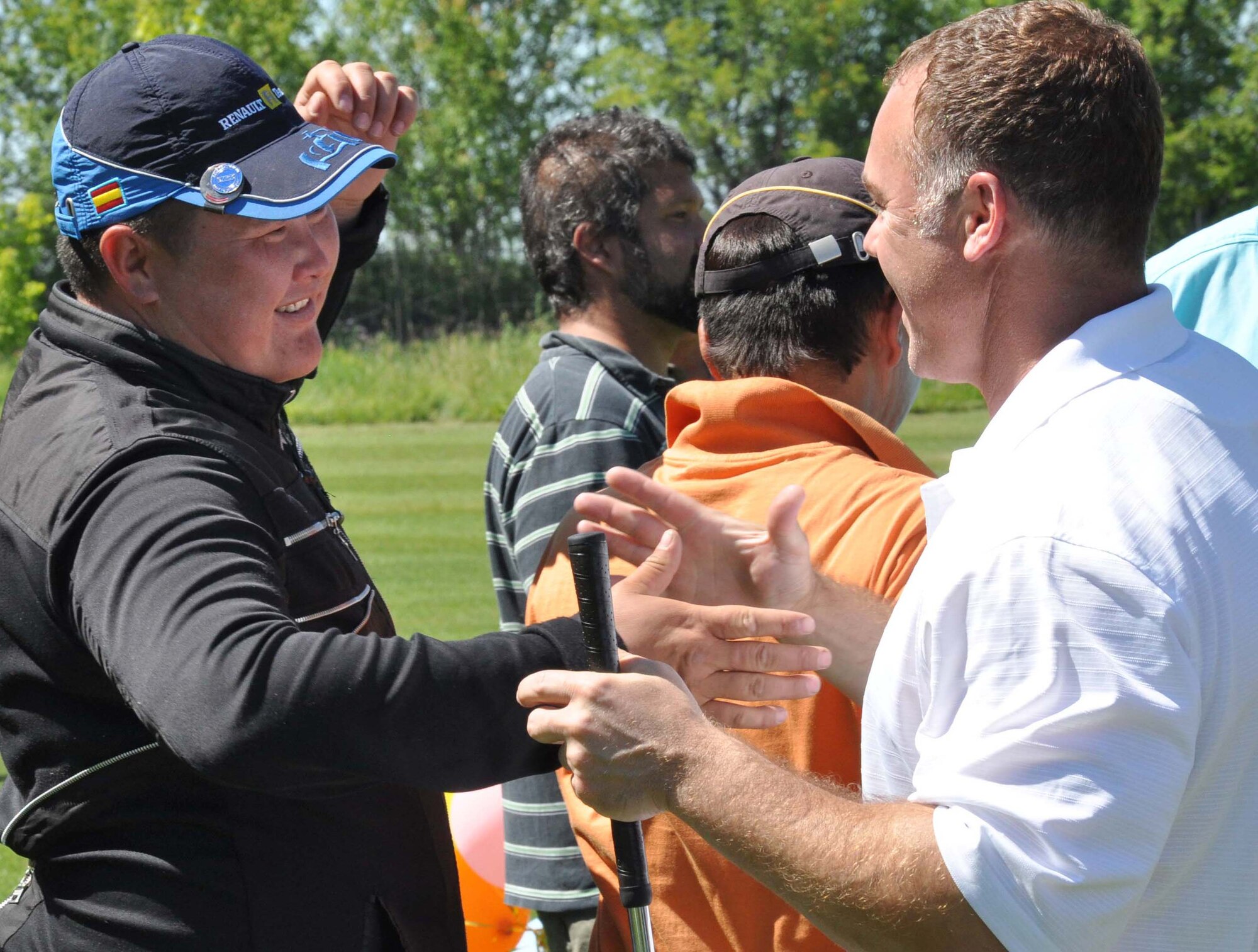 Don Smith, a 376th Expeditionary Civil Engineer Squadron?s fire and emergency services specialist, celebrates his successful ?chip off,? which won his ?9-1-1? team first place in the 3rd Annual Maple Leaf Golf Course ?Friends Support You? tournament May 29, 2010. (U.S. Air Force photo/Staff Sgt. Carolyn Viss)