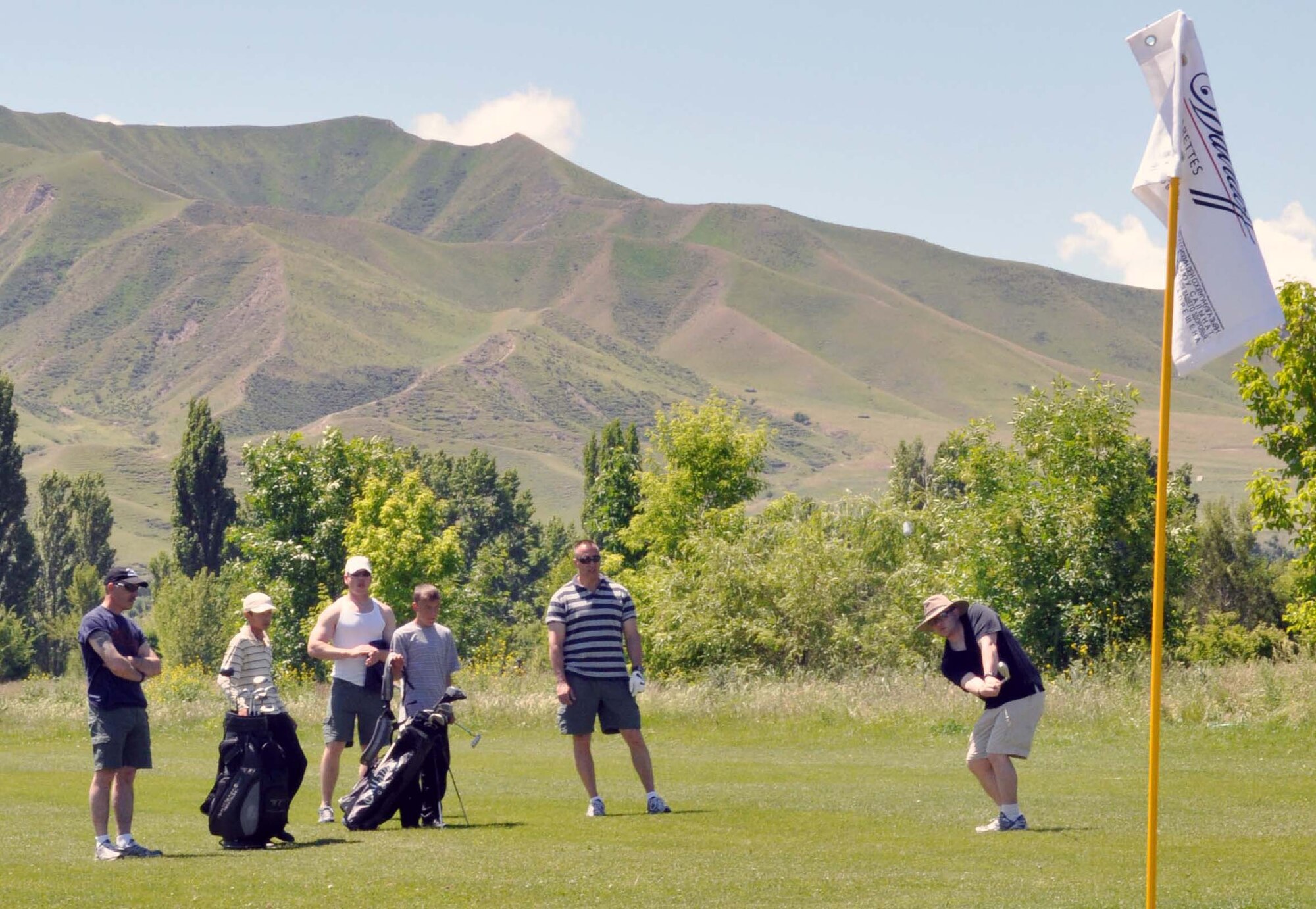 Airmen from the Transit Center at Manas, Kyrgyzstan, participate in the 3rd Annual Maple Leaf Golf Course ?Friends Support You? tournament May 29, 2010. The Transit Center at Manas, including both Airmen and civilians, is notorious for providing humanitarian assistance in the country of Kyrgyzstan, both by participating in fundraising events like this tournament and through the Manas Area Benefit Outreach Society. Altogether, the golf tournament raised almost $4,000 to help offset the cost of Mr. Miles? treatment. (U.S. Air Force photo/Staff Sgt. Carolyn Viss)