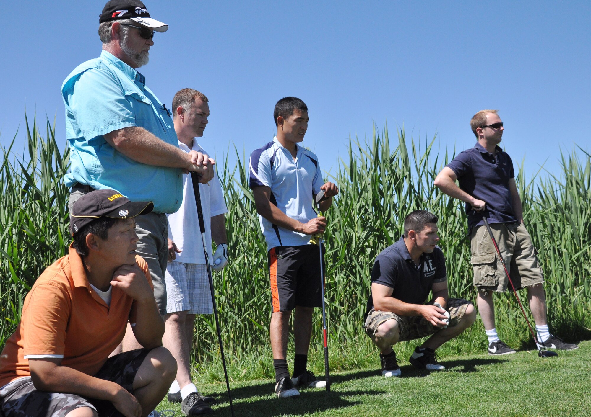 The ?9-1-1? team of civilian contracted emergency responders from the Transit Center fire department and security forces squadron watches their teammate drive the ball down the fairway during the 3rd Annual Maple Leaf Golf Course ?Friends Support You? tournament May 29, 2010. For the second year in a row, this team won first place in the event, which benefitted Ed Miles, the owner of the course, who was diagnosed with bladder cancer this year. (U.S. Air Force photo/Staff Sgt. Carolyn Viss)