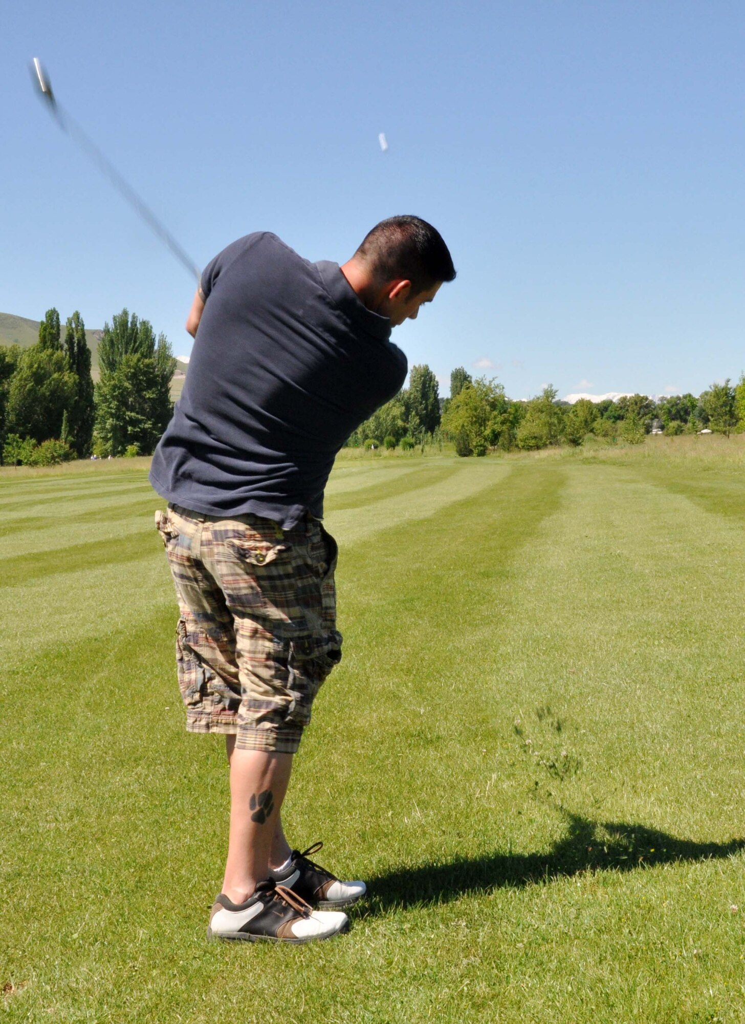 Joe Villalobos, a 376th Expeditionary Security Forces Squadron military working dog trainer, drives the ball down the fairway during the 3rd Annual Maple Leaf Golf Course ?Friends Support You? tournament May 29, 2010. His team, comprised of civilian contracted emergency responders from the Transit Center fire department and security forces squadron won first place in the event, which benefitted Ed Miles, the owner of the course, who was diagnosed with bladder cancer this year. (U.S. Air Force photo/Staff Sgt. Carolyn Viss)