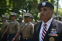 PELHAM, N. Y. - James Dike, a retired Army Vietnam veteran and member of the American Legion Post 50 in Pelham, leads a formation of Marines as they march as part of the town's Memorial Day ceremonies May 31. The Marines were on hand as part of Fleet Week New York 2010. This is the 26th year New York City has hosted the sea services for Fleet Week. More than 3,000 Marines, Sailors and Coast Guardsmen are in the area participating