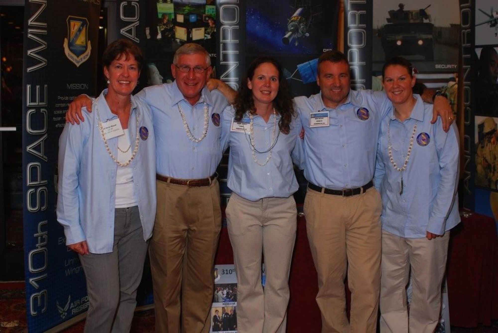 From left, Col. Karen Rizzuti, Lt. Col. (Chaplain) Robert Leivers,  Maj. Shanna Corbett, Col. Mark Hustedt, and Tech. Sgt. Kasey Grindrod manned the the wing display at the HRDC workshop in Atlanta on Oct. 27. The group shared the accomplishments of the 310th Space Wing that would later Garner the McNeil Award.(Courtesy photo)