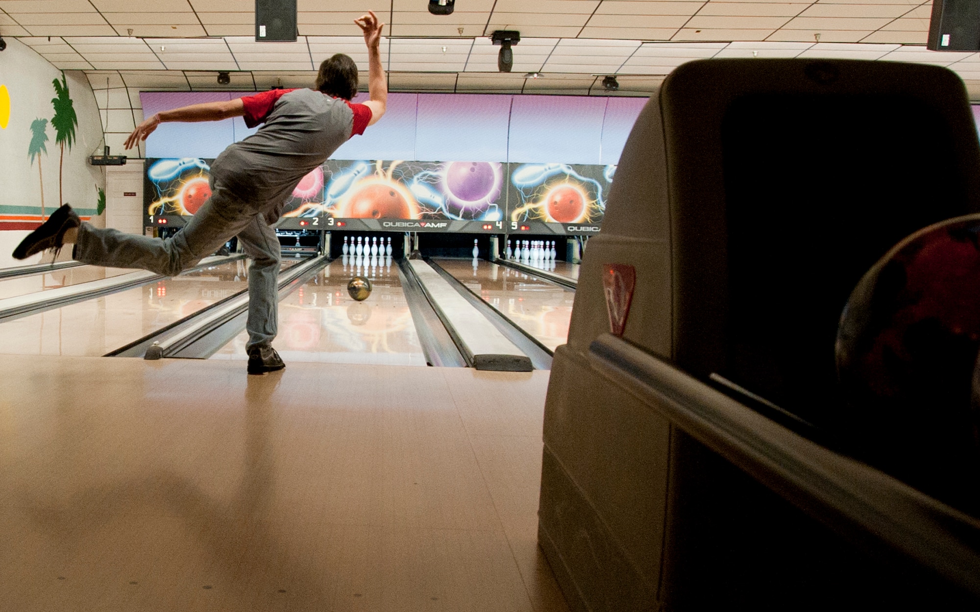 Chuck Clifford rolls another strike at Eglin Lanes Oct. 29 during the base’s Friday night league.  Mr. Clifford bowled an 886 for his three game series during Eglin’s Friday league Oct 22.  That feat broke the county record by 20 points and ranked second highest ever in the state of Florida.  (U.S. Air Force photo/Samuel King Jr.)