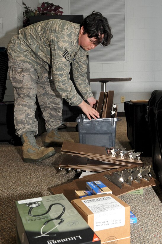 LANGLEY AIR FORCE BASE, Va -- Tech. Sgt. Cathryn Leclair, 633d Medical Group NCO in charge of inpatient pharmacy services, sorts out supplies before the Public Disease Outbreak Exercise Oct. 28. This second annual Major Accident Response Exercise involving a disease outbreak is designed to evaluate the distribution of the prophylactic influenza to 5,000 personnel in 48 hours in case of a pandemic outbreak on base. (U.S. Air Force photo/Staff Sgt. Ashley Hawkins)(RELEASED)