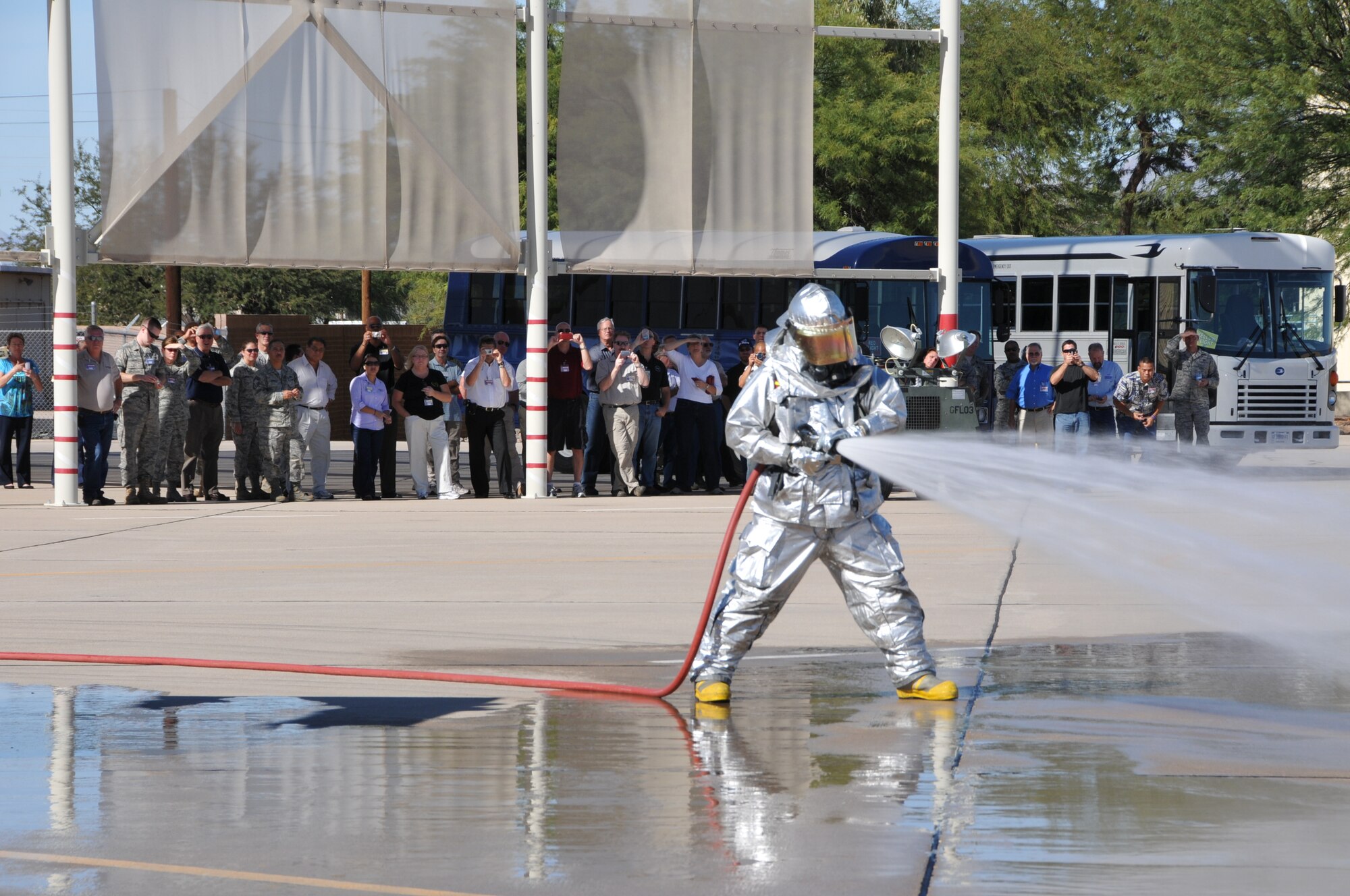 Employers from 10 western states and territories witness a capabilities demonstration by Air National Guard firefighters at the 162nd Fighter Wing Oct. 28. The Air National Guard’s Business and Industry Days event held here gave employers first-hand exposure to how Guardsmen serve United States as well as their civilian employers. (U.S. Air Force photo/Master Sgt. Dave Neve)