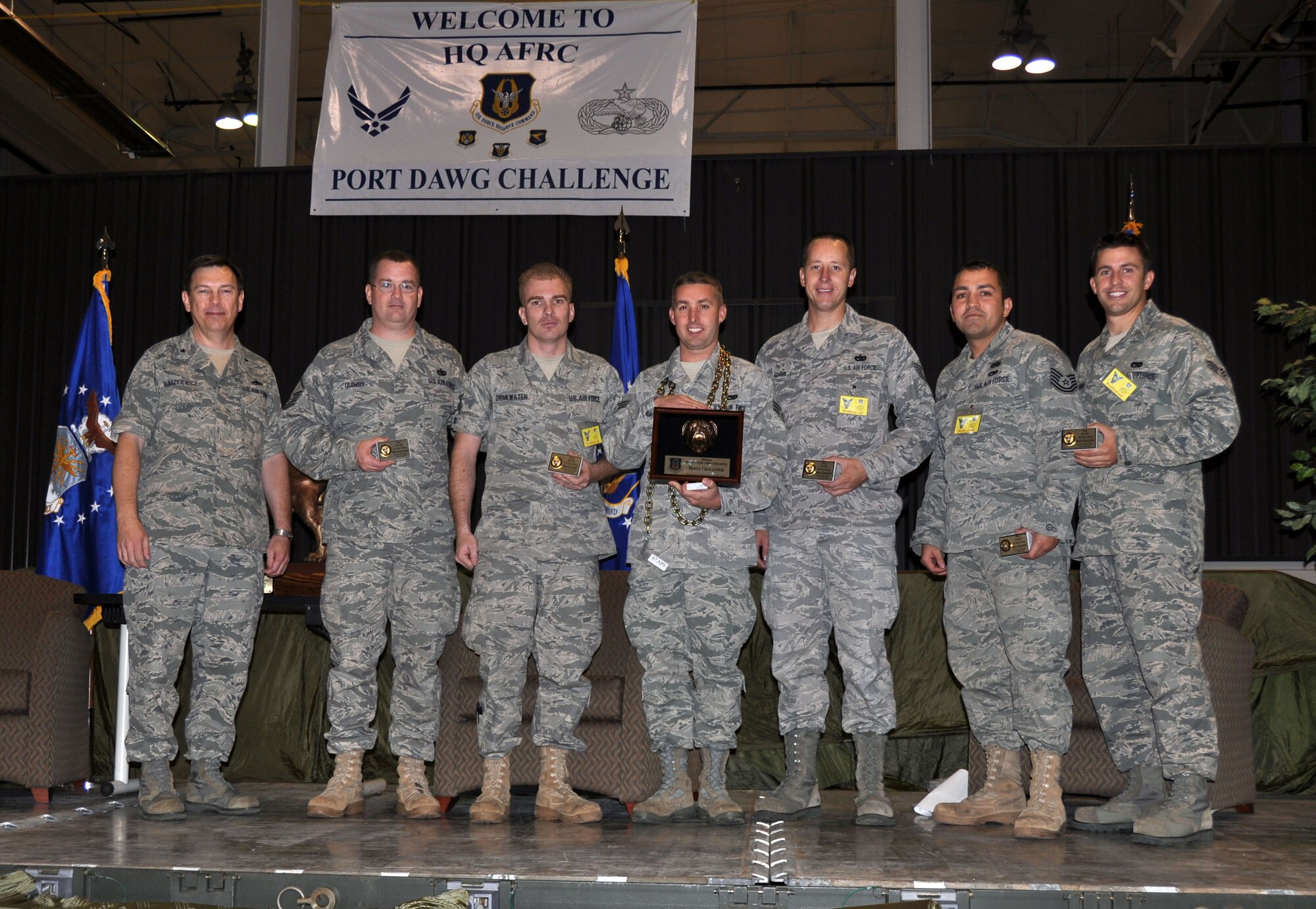 Brig. Gen. Gary Blaszkiewicz, Director of Logistics for Headquarters AFRC, stands beside the 67th aerial porters who won two of 11 events at AFRC’s Port Dawg Challenge last week.