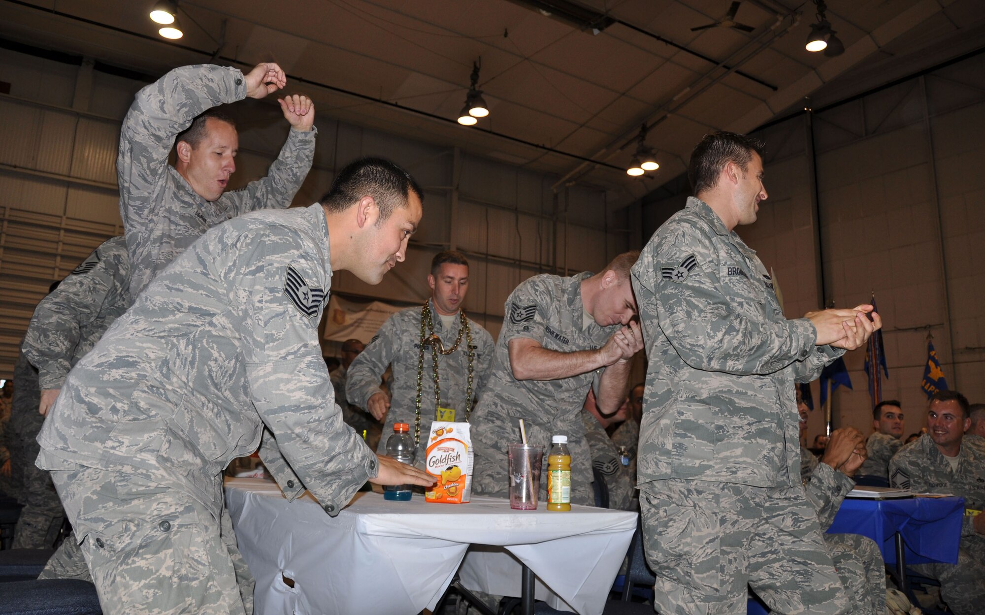The 67th aerial porters react to their names being called as winners of the fit-to-fight event at AFRC’s Port Dawg Challenge last week. The 67th APS team also scored first place in the PDC trivia event. (U.S. Air Force photo/Bryan Magaña)