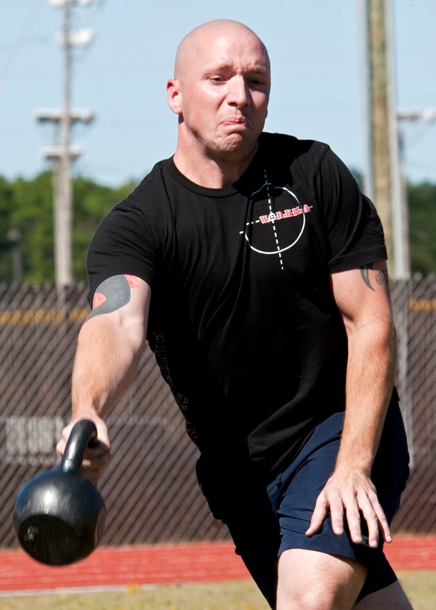 Jon Vickery, 96th Force Support Squadron, releases the 35-pound kettle bell during the kettle toss competition at Eglin’s first ever Strongman Competition Oct. 29.  20 of Eglin’s top men and women competed in four events to determine who was the base’s strongest.  Vickery took home the top prize in the middleweight division.  (U.S. Air Force photo/Samuel King Jr.)