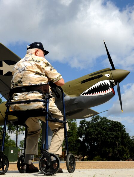 MOODY AIR FORCE BASE, Ga. -- Everett Krippner, brother of a fallen Flying Tiger, sits in front of a static P-40 Warhawk during the Flying Tiger Reunion here Oct. 29. Mr. Krippner came to the reunion in honor of his brother Howard Krippner, a pilot who was killed in action while fighting in China during World War II. (U.S. Air Force photo/Airman 1st Class Benjamin Wiseman)(RELEASED)