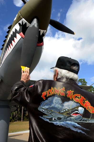 MOODY AIR FORCE BASE, Ga. -- Retired Col. J.M. Taylor, retired member of the Flying Tigers, reminisces as he touches the propeller of a static P-40 Warhawk during the Flying Tiger Reunion here Oct. 29. Mr. Taylor flew the P-40 over China during World War II from 1943 to 1944. (U.S. Air Force photo/Airman 1st Class Benjamin Wiseman)(RELEASED)