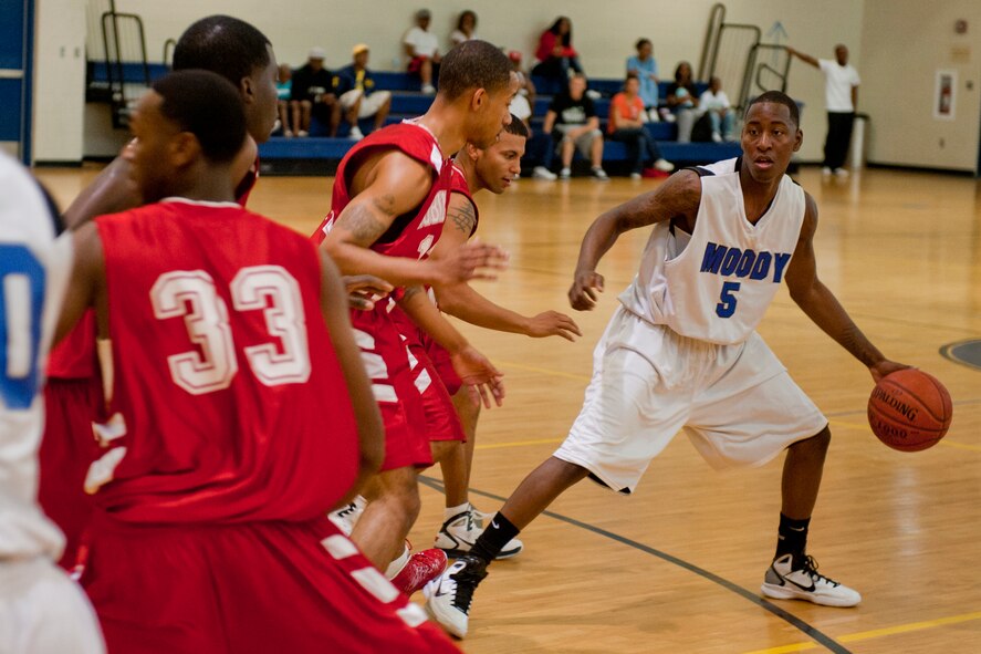 MOODY AIR FORCE BASE, Ga. -- Aaron Yarborough, varsity team point guard, handles the ball during a basketball game against Robins Air Force Base Oct. 30. Moody lost the game 75-60. (U.S. Air Force photo/Senior Airman Jamal D. Sutter)(RELEASED)