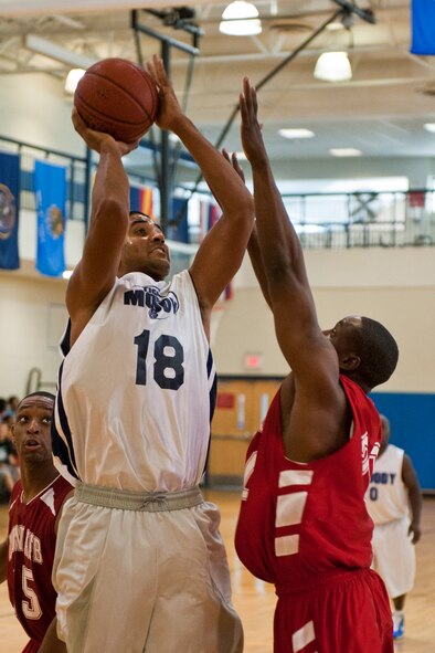 MOODY AIR FORCE BASE, Ga. -- Tobias Ellis, varsity team power forward, attempts a jump shot during a basketball game against Robins Air Force Base Oct. 30. After being down by 9 points at the end of the first half, Moody gained momentum with a 6-0 run to start the second. (U.S. Air Force photo/Senior Airman Jamal D. Sutter)(RELEASED)