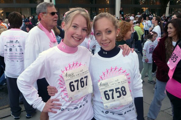 KNOXVILLE, Tenn. - Jessica M. Wolbert, right, a human resources technician with The I.G. Brown Air National Guard Training and Education Center, and her sister, McKenna Lindquist, left, participate in the 14th Annual Susan G. Komen Race for the Cure events at World's Fair Park here, Oct. 31, 2010.  The women ran the 5K race to support the fight against breast cancer.  (U.S. Air Force photograph by Justin Wolbert/Released)
