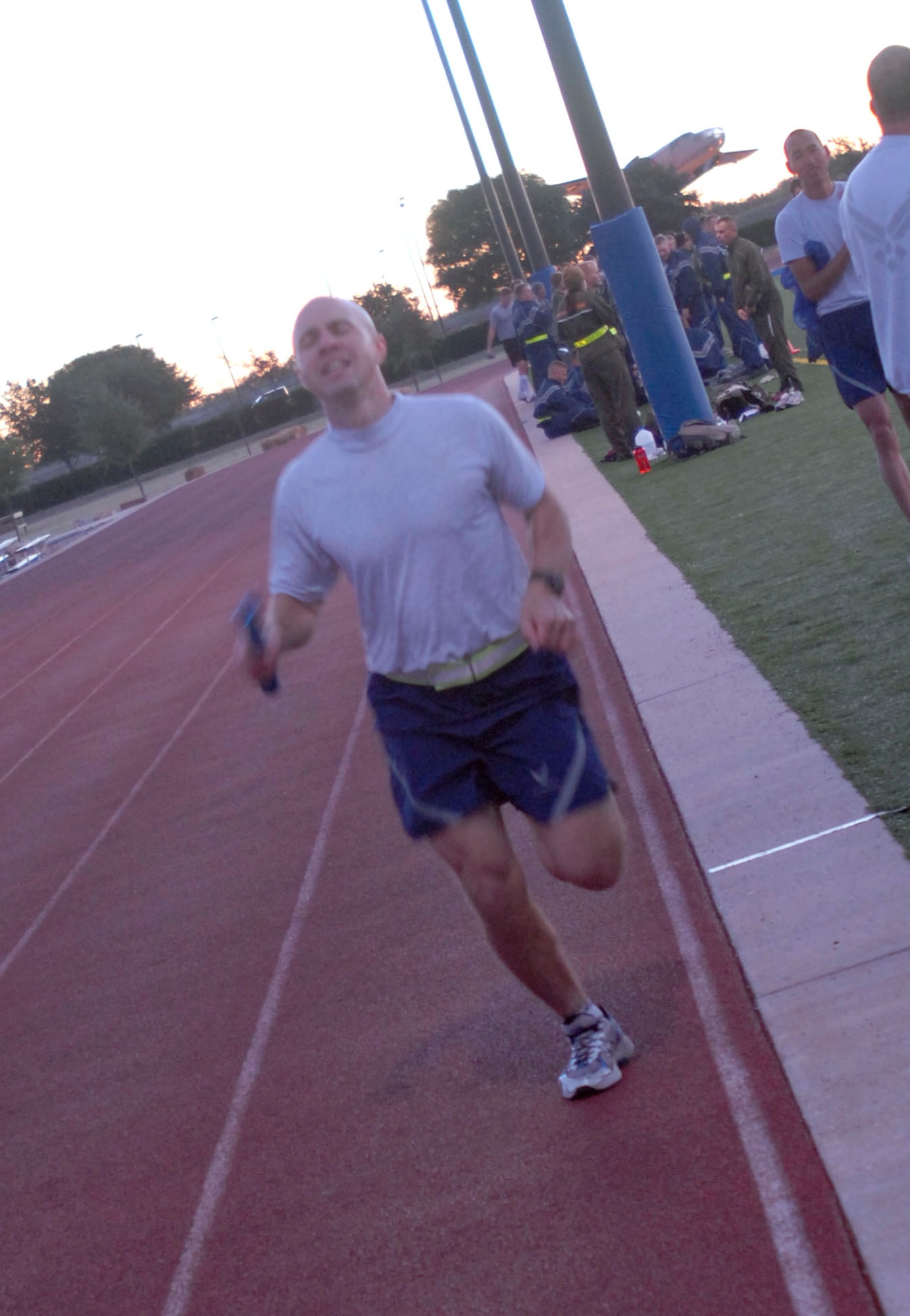 GOODFELLOW AIR FORCE BASE, Texas-- Major Michael C. Goodman, 17th Comptroller Squadron commander finishes his portion of a one mile relay race Oct. 29 at the Mathis Fitness Center here. The race was one of several sports and fitness events servicemembers participated in as part of the quarterly Sports Day event. (U.S. Air Force photo/Airman 1st Class Jessica D. Keith)