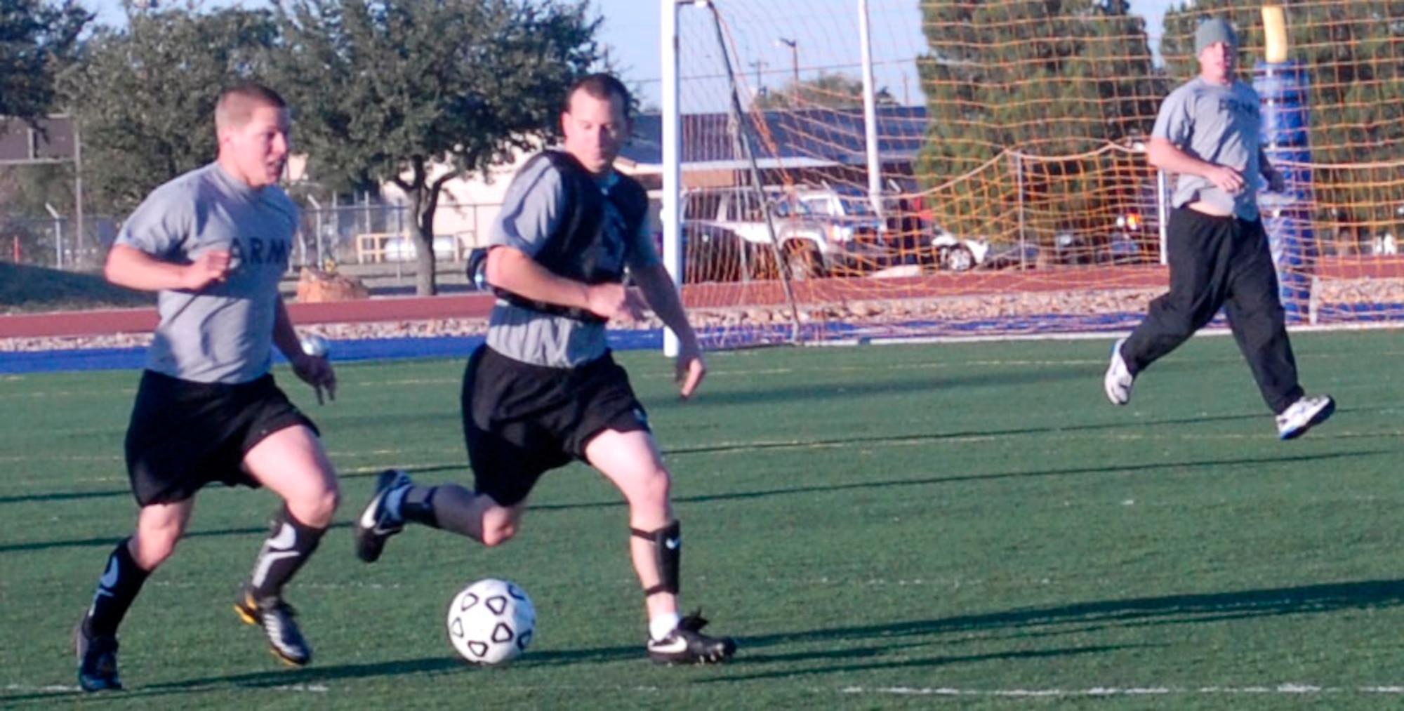 GOODFELLOW AIR FORCE BASE, Texas-- Soldiers compete against the Marines in a soccer game Oct. 29 at the Mathis fitness center here. The event, which took place as part of the quarterly Sports Day was one of several that took place during the morale-boosting event.  (U.S. Air Force photo/Airman 1st Class Jessica D. Keith)