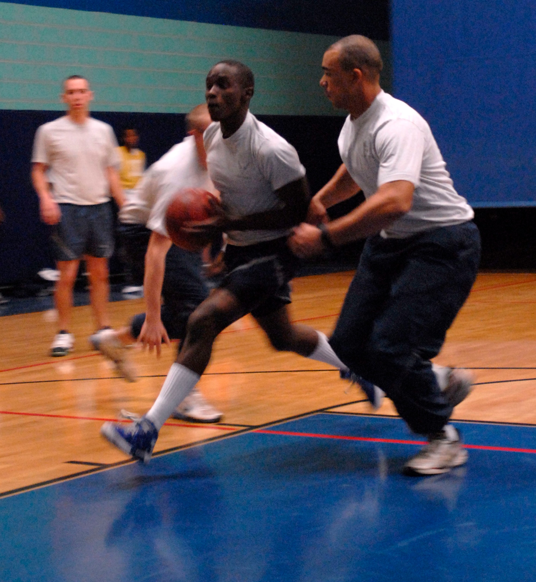 GOODFELLOW AIR FORCE BASE, Texas-- Airmen face-off in basketball as part of the quarterly Sports Day Oct. 29 at the Mathis fitness center here.  Servicemembers also participated in dodgeball, kickball and other sports, including a relay race during the day-long event. (U.S. Air Force photo/Airman 1st Class Jessica D. Keith)