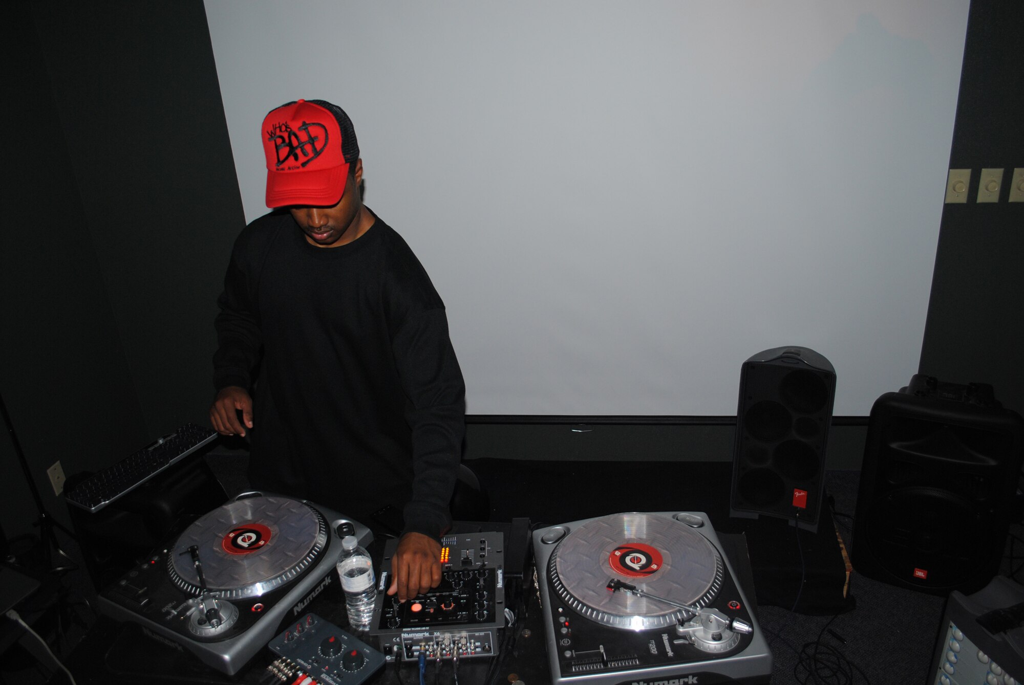 Airman 1st Class Justin Grant, 741st Missile Security Forces Squadron member, adjusts the bass on the turntables for the music at the Airman’s Councils Halloween party Oct. 22 at the Detour.(U.S. Air Force photo/Airman 1st Class Kristina Overton)