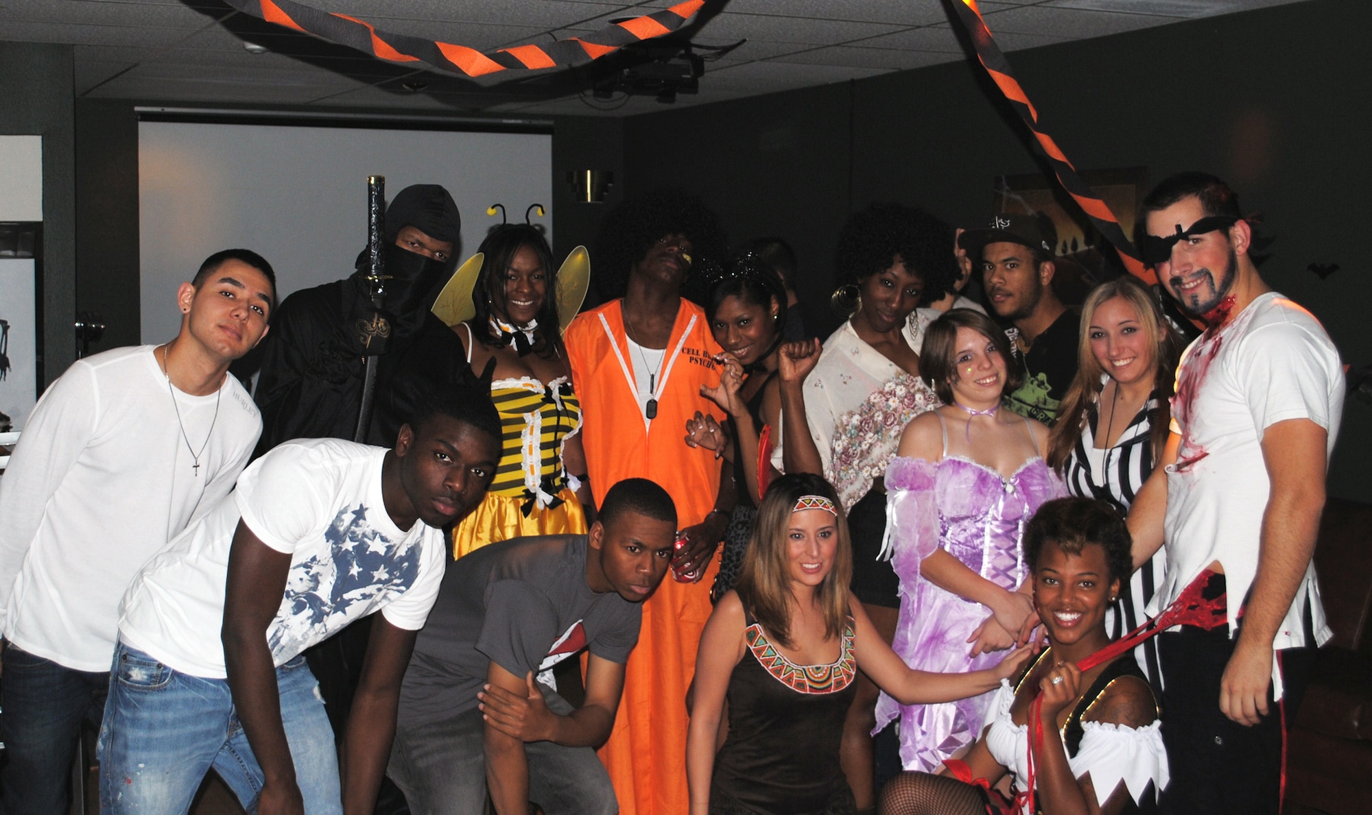 Several of the Airmen in attendance gather for a group photo at the Airman’s Council’s Halloween party at the Detour Oct. 22.(U.S. Air Force photo/Airman 1st Class Kristina Overton)