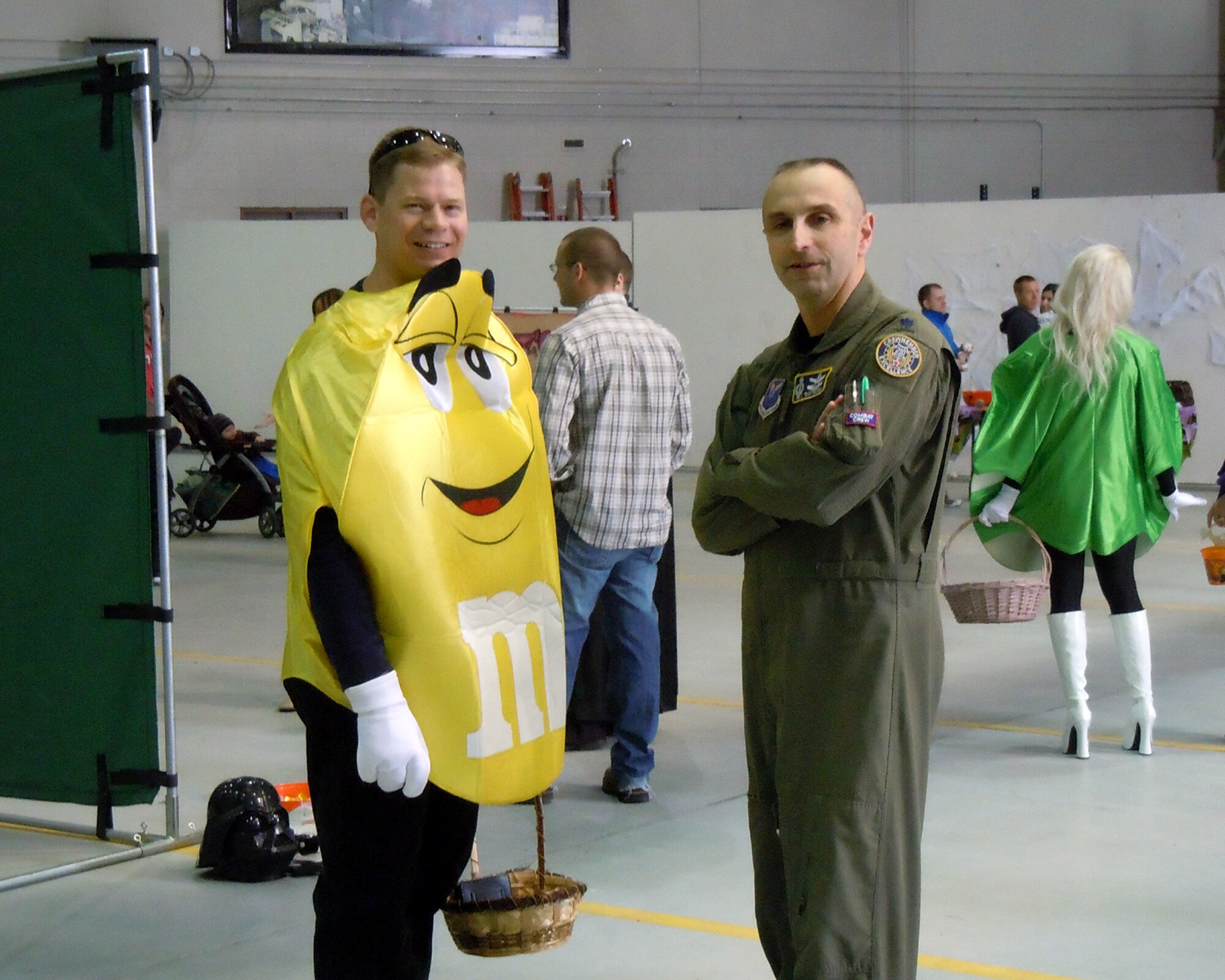 Lt. Col. Peter Bonetti, 10th Missile Squadron commander, left, and Lt. Col. Lloyd Buzzell, 341st Operations Support Squadron commander, take a break from the festivities to pose for a photo at the Operations Group Fall Festival Oct. 23. Several families from the group and squadron leadership joined in the celebration at the 3-bay Hangar. (courtesy photo)