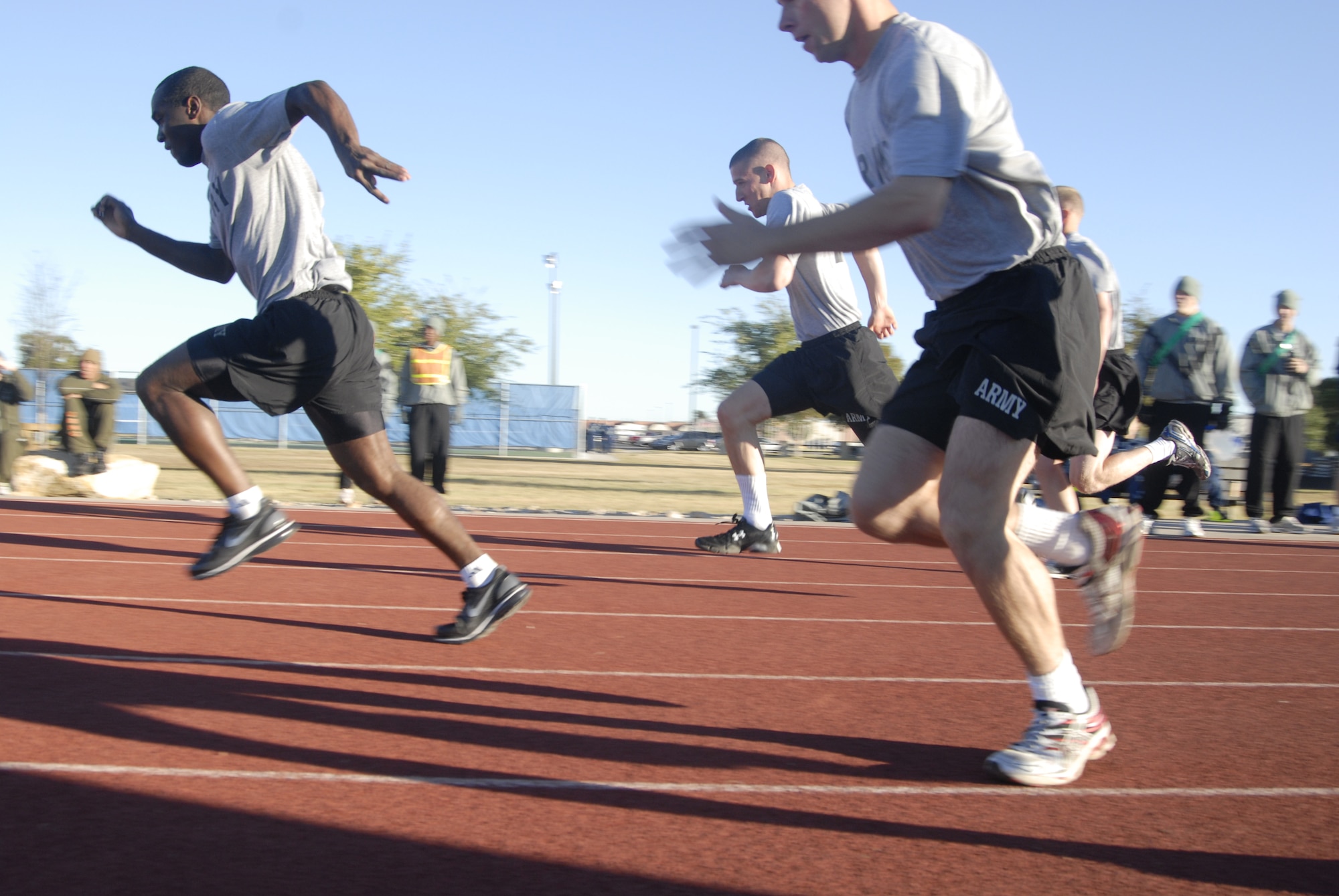 GOODFELLOW AIR FORCE BASE, Texas - The 344th Military Intelligence Battalion Soldiers sprint in the 100 meters dash during the 17th Training Wing Quarterly Sports Day held Oct. 29. (U.S. Air Force photo/Airman 1st Class Anne Gathua)