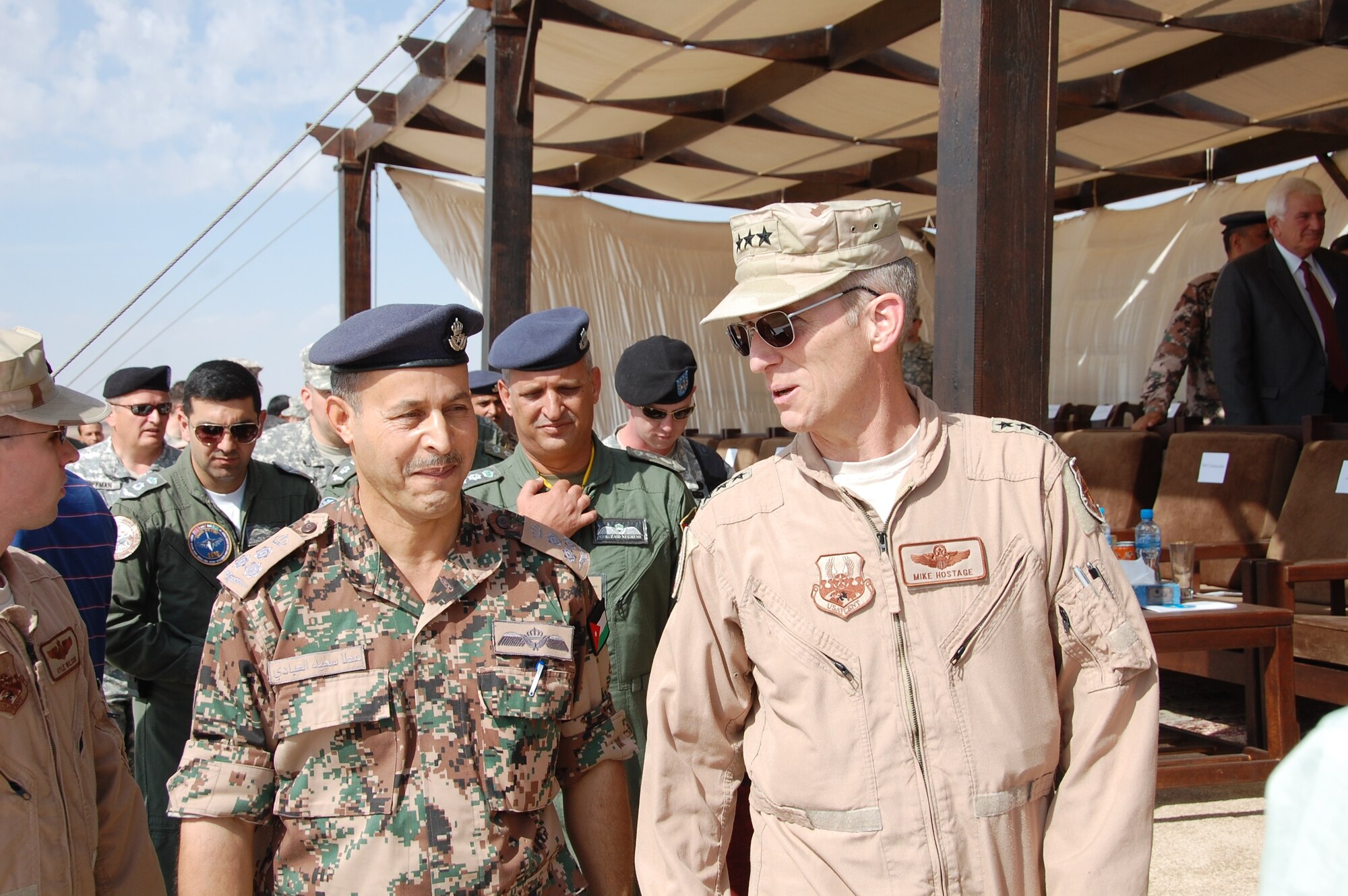 Lt. Gen. Mike Hostage, U.S. Air Forces Central Command commander, speaks with a Jordanian senior officer during Falcon Air Meet 2010 at the Royal Jordanian Air Base in Azraq, Jordan. General Hostage visited the base Nov. 1 where a contingent of 250 Air Force members have been competing in a two week competition with Jordan, Pakistan and the United Arab Emirates.  (U.S. Air Force Photo by Mr. Alan Black)