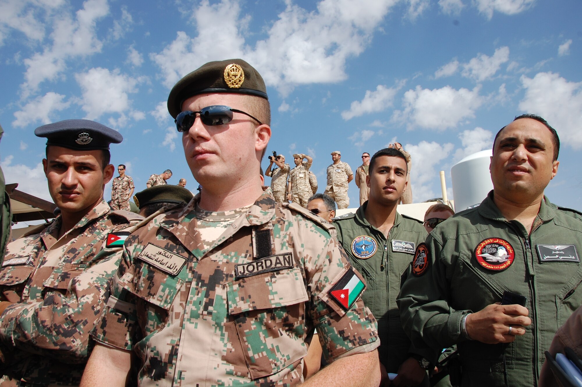 Members of the Royal Jordanian Air Force and the Pakistani Air Force watch American F-16 drop munitions during a live fire competition at Falcon Air Meet 2010 in Azraq, Jordan. Falcon Air Meet is an annual meet hosted by the Jordanians and this year marks the fourth year of U.S. Air Forces Central Command's participation in the event. More than 250 Airmen from around the Air Force came to Jordan to make up the U.S. contingent. (U.S. Air Force Photo by Mr. Alan Black)