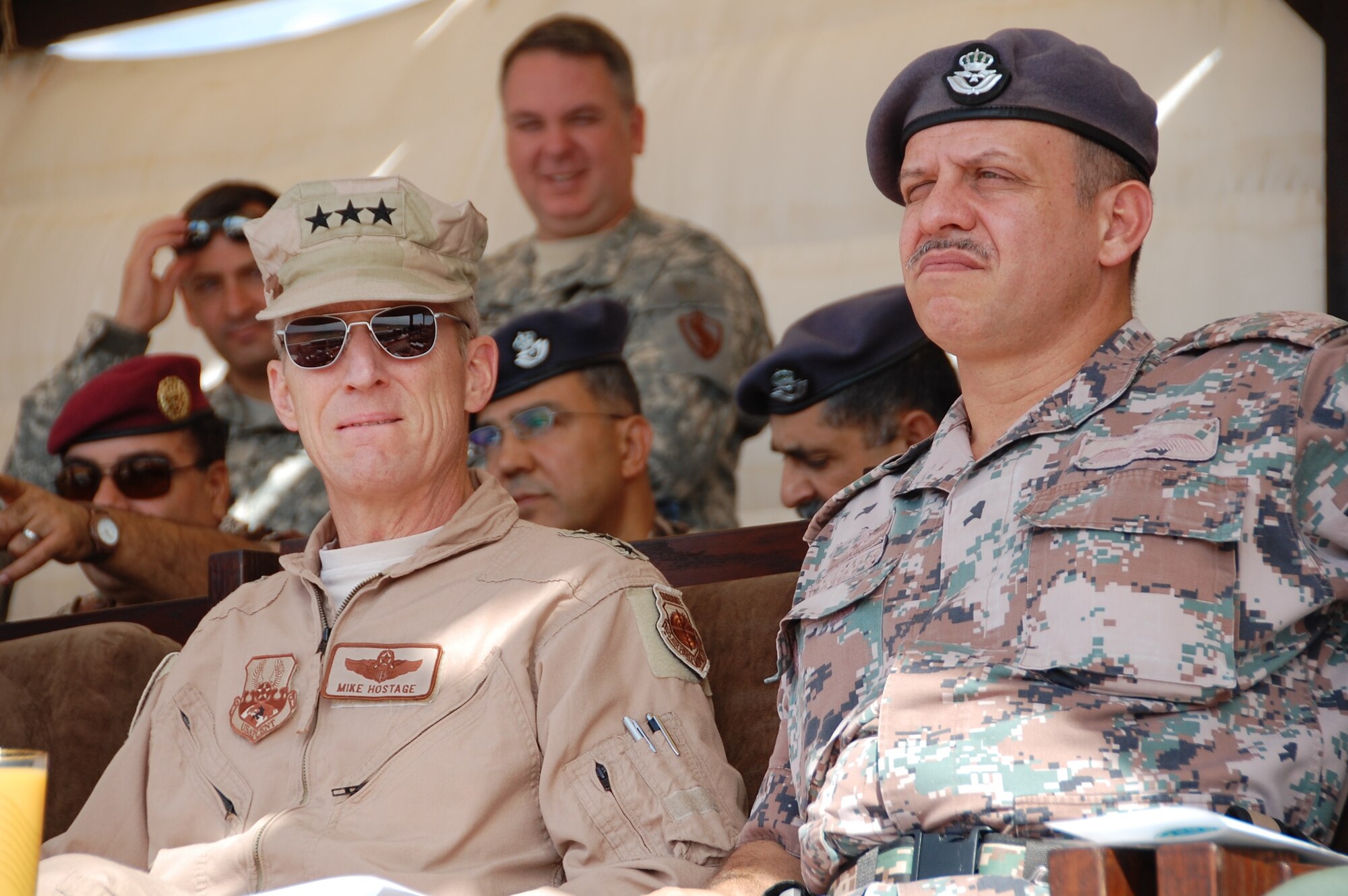 Lt. Gen. Mike Hostage, U.S. Air Forces Central Command commander, watches a live fire demonstration with Prince Faisal bin Al Hussein of Jordan during Falcon Air Meet 2010 at the Royal Jordanian Air Base in Azraq, Jordan. A group of roughly 50 senior officers joined the prince to watch each country participating in Falcon Air Meet 2010 drop bombs on target as part of a live fire competition. (U.S. Air Force Photo by Mr. Alan Black)