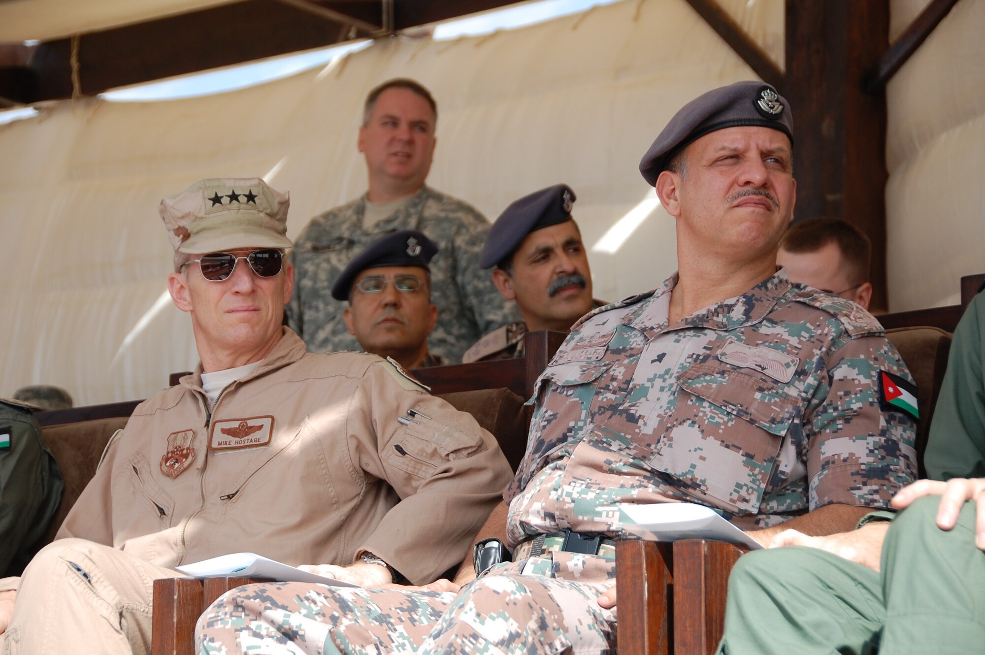 Lt. Gen. Mike Hostage, U.S. Air Forces Central Command commander, watches a live fire demonstration with Prince Faisal bin Al Hussein of Jordan during Falcon Air Meet 2010 at the Royal Jordanian Air Base in Azraq, Jordan. General Hostage visited the base Nov. 1 where a contingent of 250 Air Force members have been competing in a two week competition with Jordan, Pakistan and the United Arab Emirates.  (U.S. Air Force Photo by Mr. Alan Black)