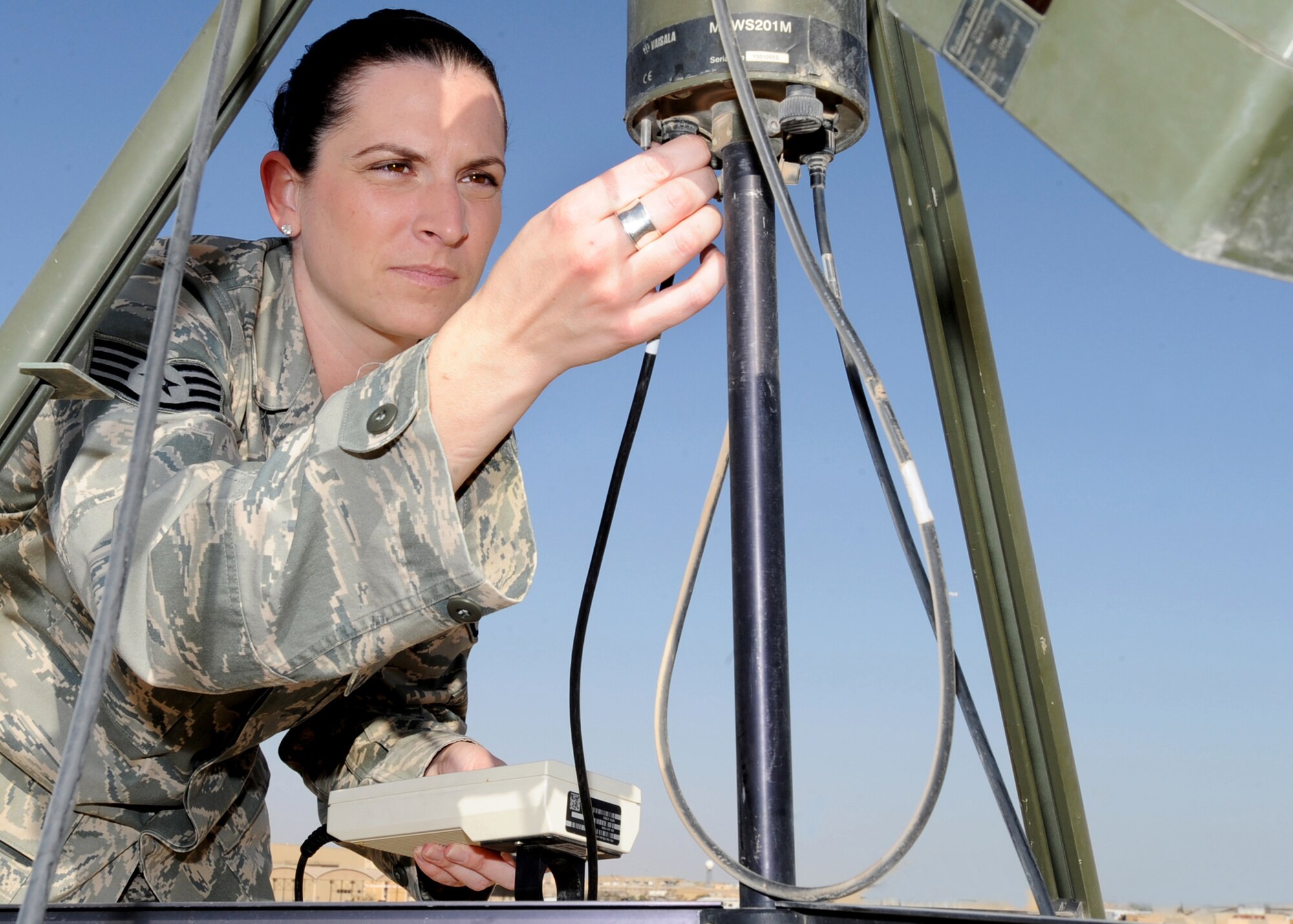 SOUTHWEST ASIA - Staff Sgt. Ashley Barnett, a weather forecaster for the 386th Air Expeditionary Wing, hooks up a TMQ-53 weather sensor to observe conditions and update forecasts at an undisclosed air base here Oct. 28, 2010. The 386th AEW forecasters work behind the scenes to provide Air Force and Army personnel with accurate, up-to-date forecasts so flying missions can continue in support of Operations Enduring Freedom and New Dawn. (U.S. Air Force photo by Senior Airman Laura Turner)