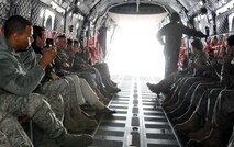 Members of the 103rd Airlift Wing capture cell phone video of the flightline from the rear of a C-27J Spartan at Bradley International Airport Friday, Oct. 22, 2010.  The Airmen were among the first of the Flying Yankees to fly in the new light cargo aircraft that visited the base to give members there a glimpse of their future mission.